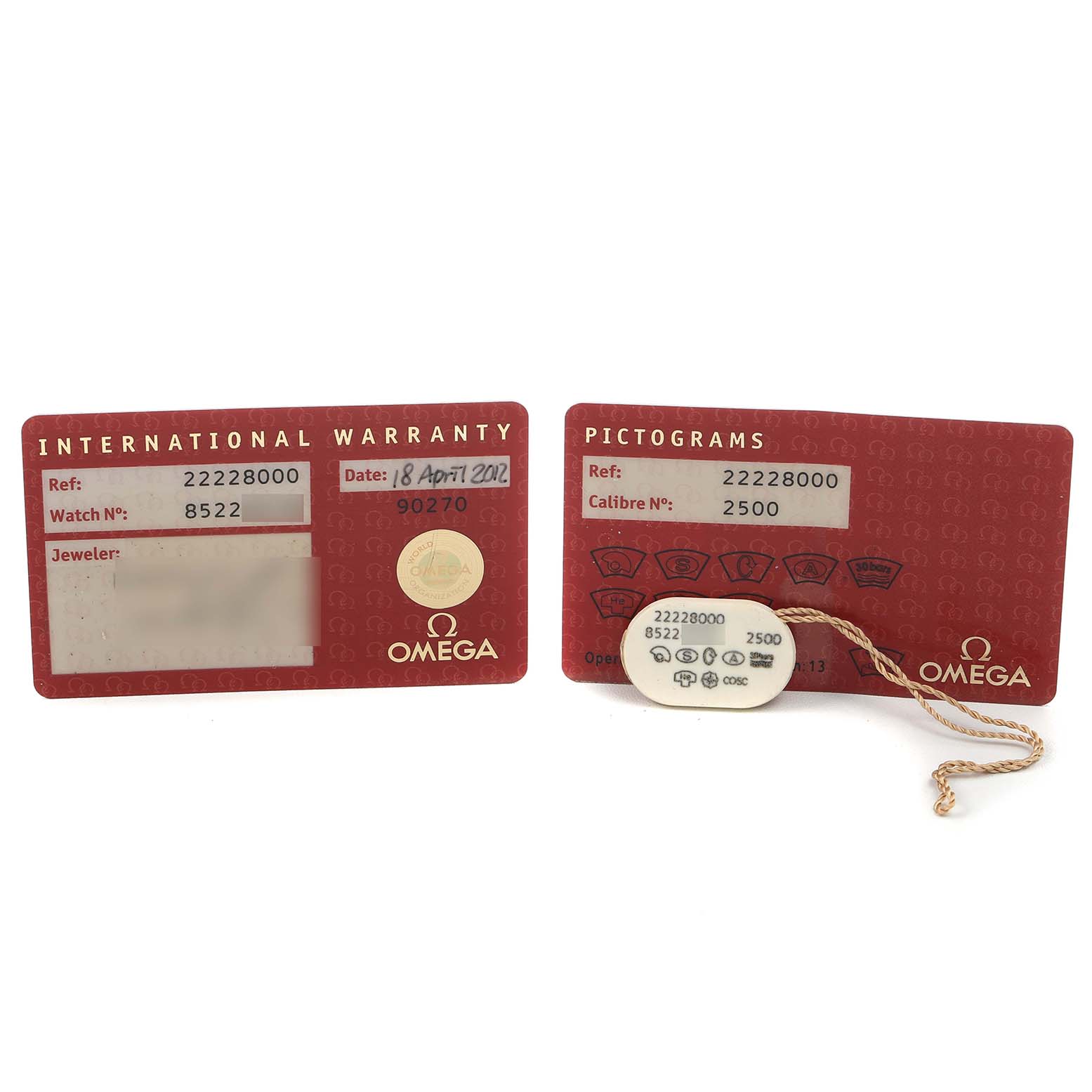 The image shows the warranty and pictogram cards for an Omega Seamaster 2222.80.00 Men's Stainless Steel Blue Dial watch, along with a hang tag.