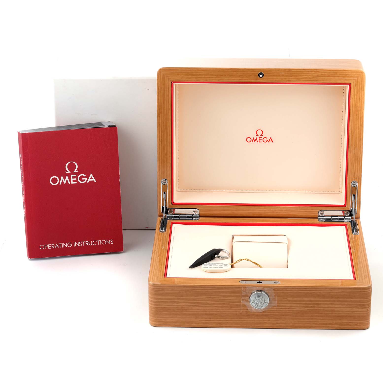 The image shows the open wooden box and operating instructions for the Omega Planet Ocean 232.30.38.20.01.001 Men
s Stainless Steel Black Dial 232.30.38.20.01.001 Men
s Stainless Steel Black Dial watch.