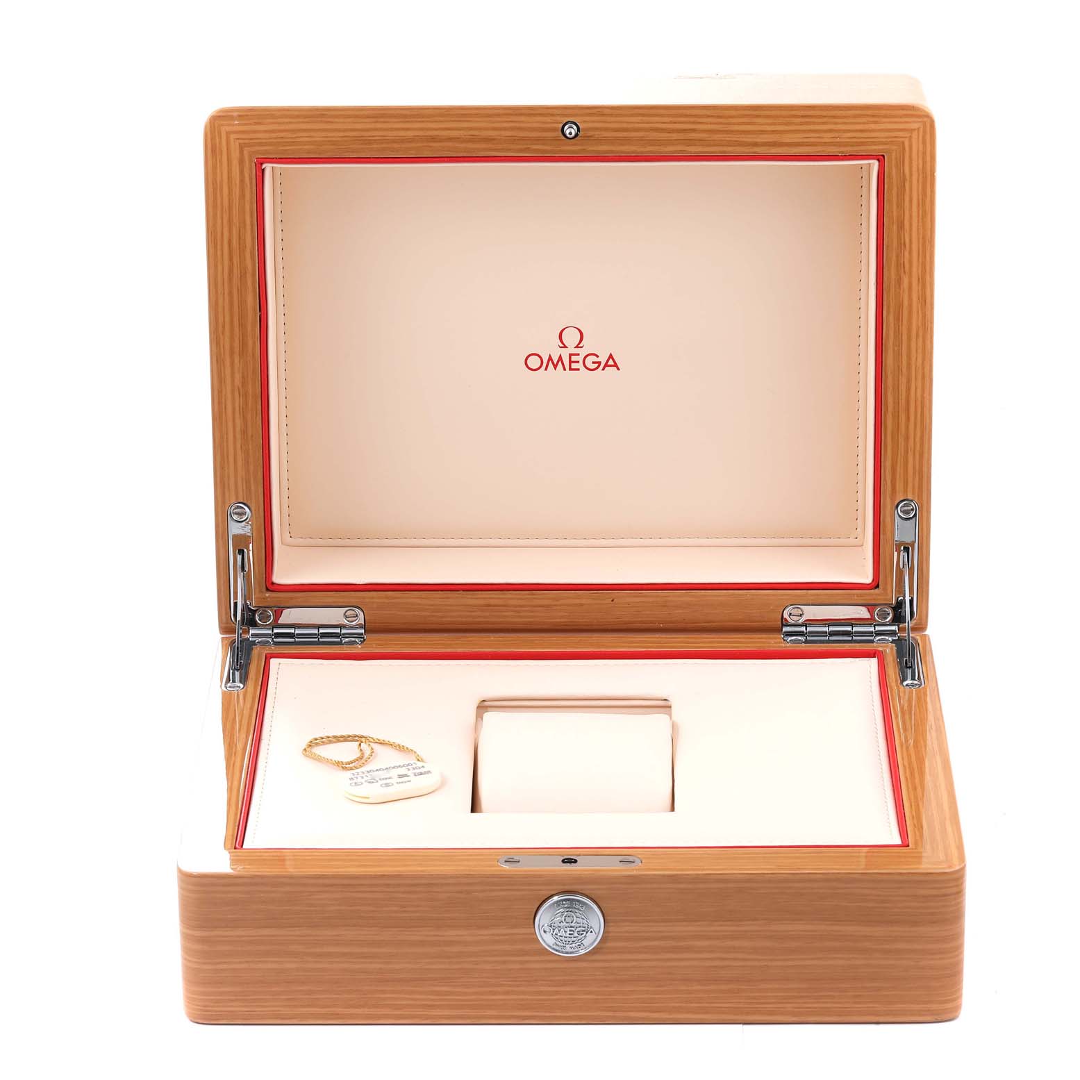 The image shows an open Omega box for the Speedmaster model, revealing an empty cushion and a tag.
