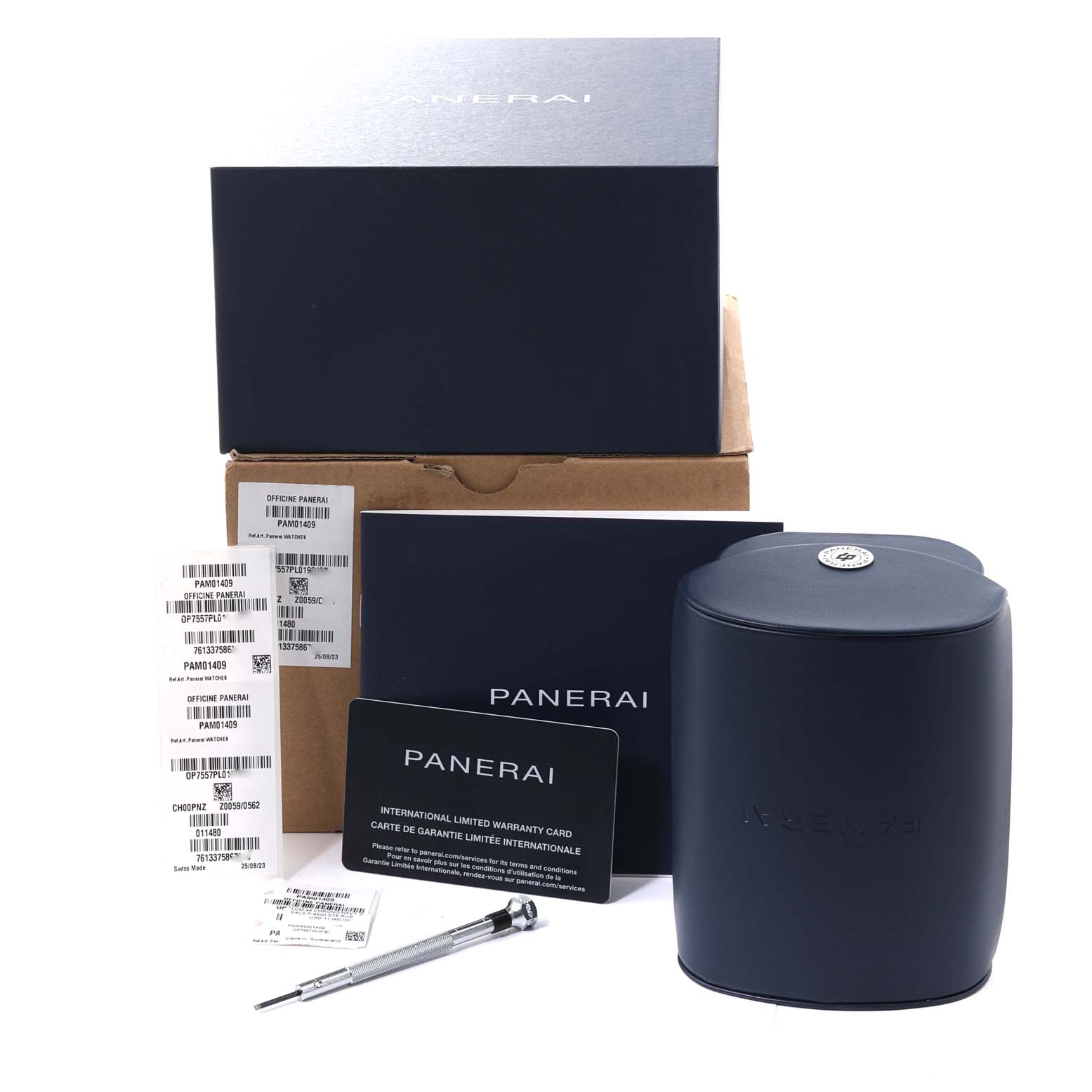 The image shows packaging, warranty card, tool, and tags for the Panerai Luminor PAM01409 Men's Stainless Steel Grey Dial PAM01409 Men's Stainless Steel Grey Dial watch from a front angle.