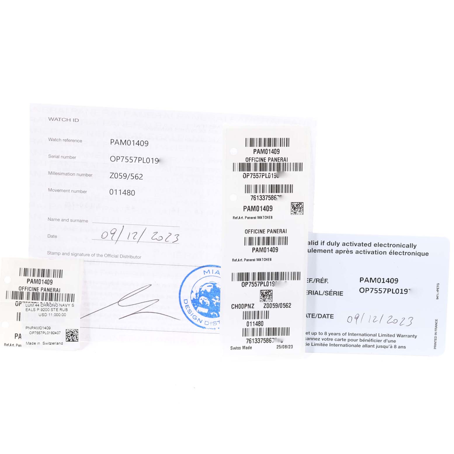 The image shows warranty cards and authenticity paperwork for the Panerai Luminor PAM01409 Men's Stainless Steel Grey Dial PAM01409 Men's Stainless Steel Grey Dial model PAM01409.