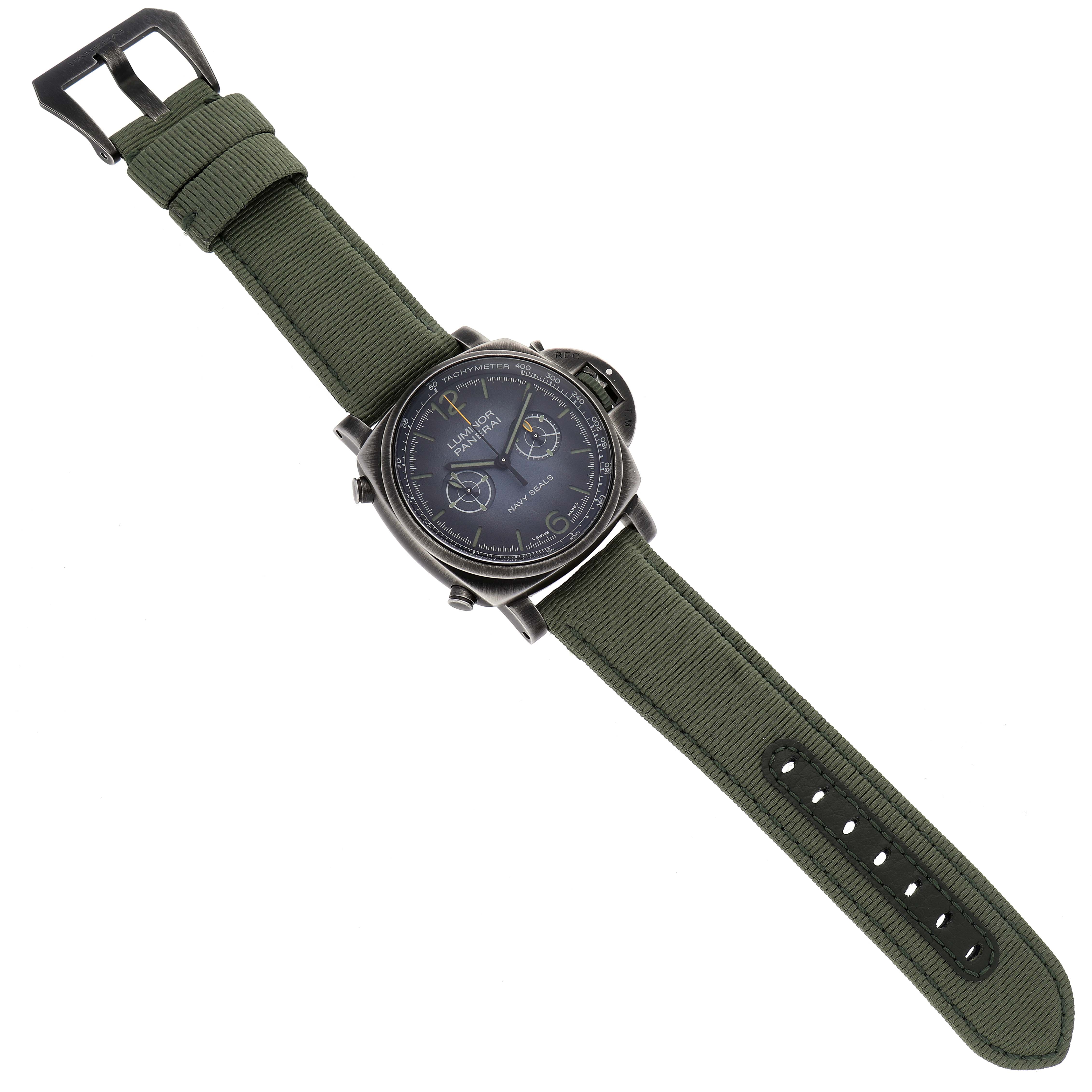 The image shows a Panerai Luminor PAM01409 Men's Stainless Steel Grey Dial PAM01409 Men's Stainless Steel Grey Dial watch with a green fabric strap, displayed flat with its face and buckle clearly visible.