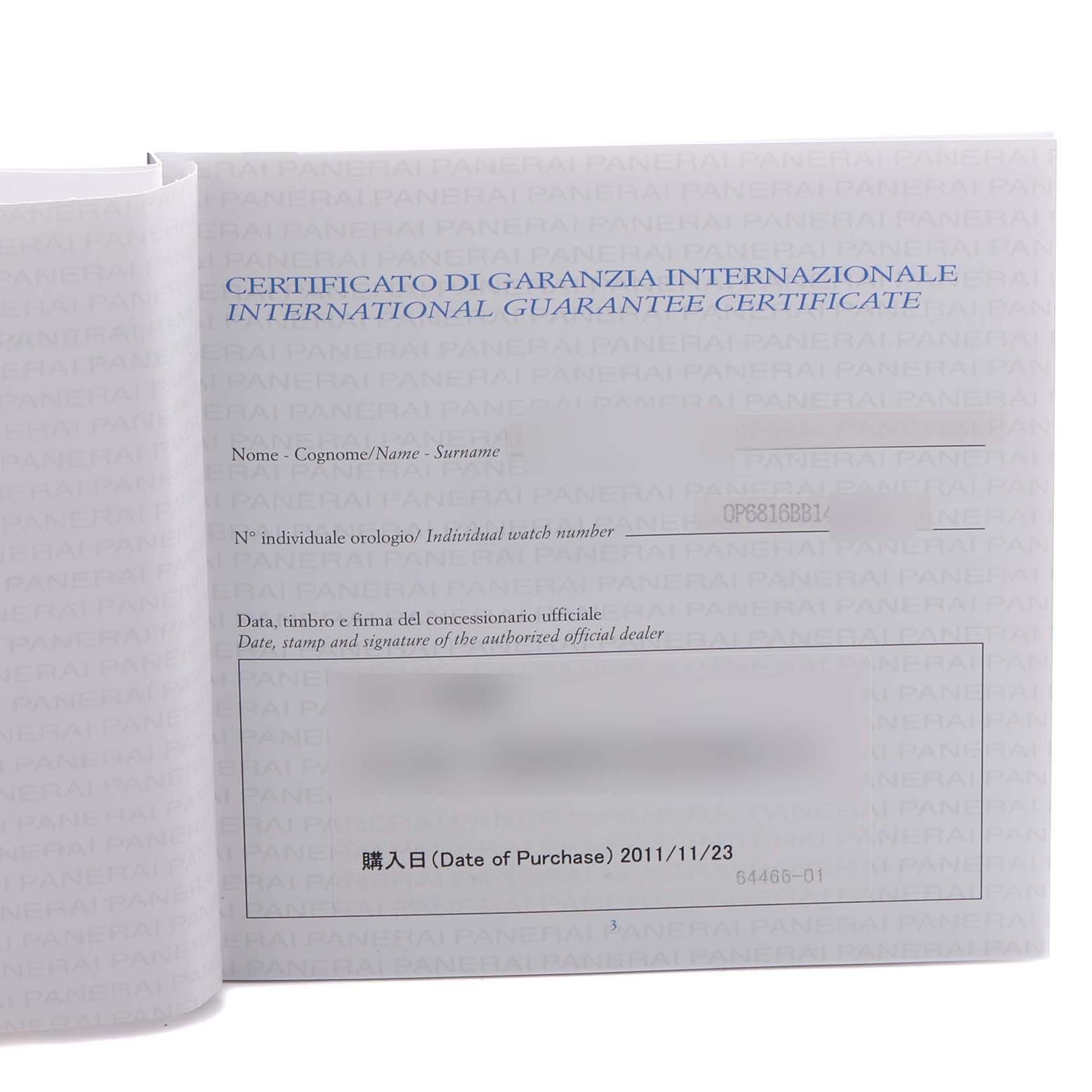 The image shows a Luminor Panerai international guarantee certificate at an angled open-book view.