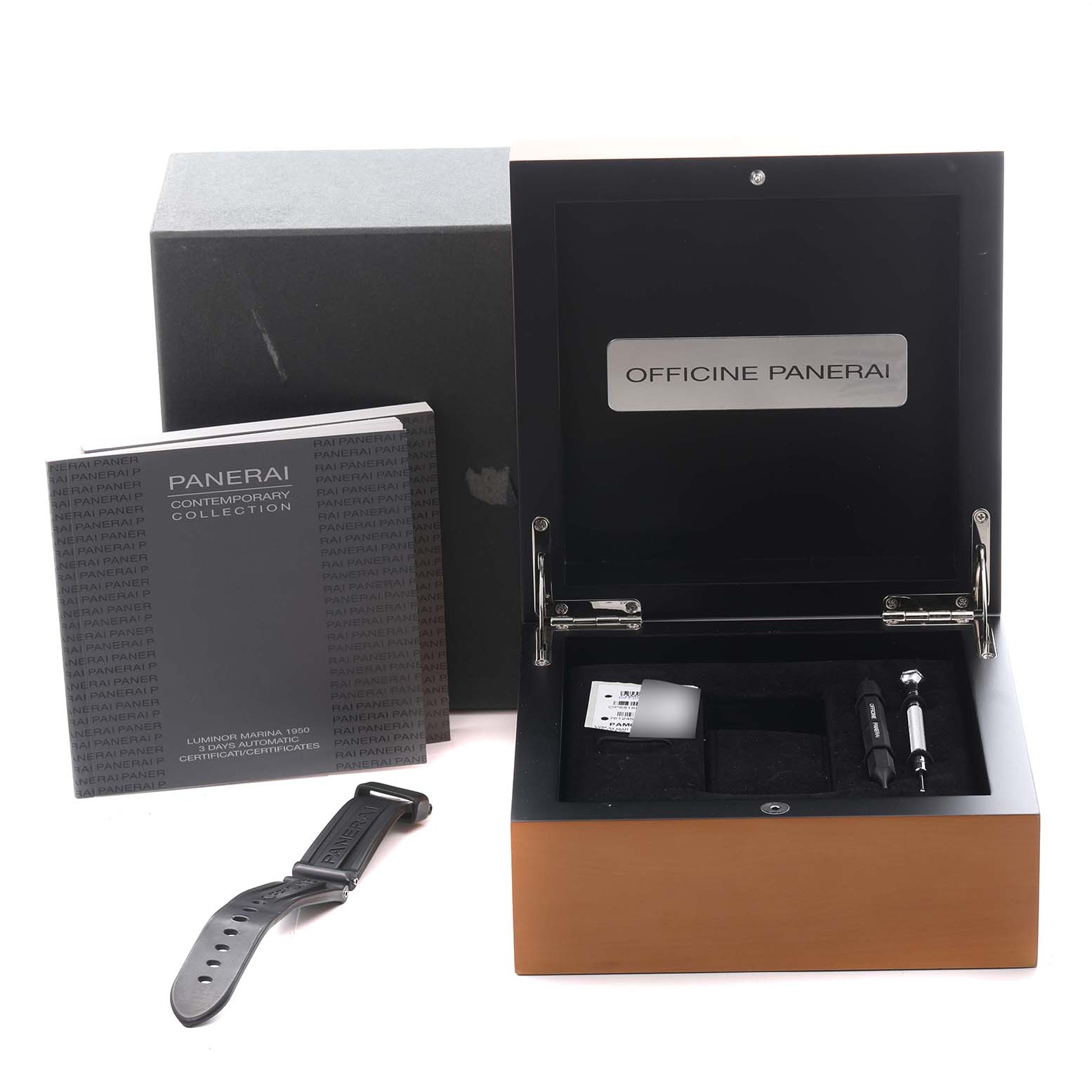 The image shows a Panerai Luminor PAM00359 Men's Stainless Steel Black Dial PAM00359 Men's Stainless Steel Black Dial box open, revealing tools and a strap, with a manual beside it.