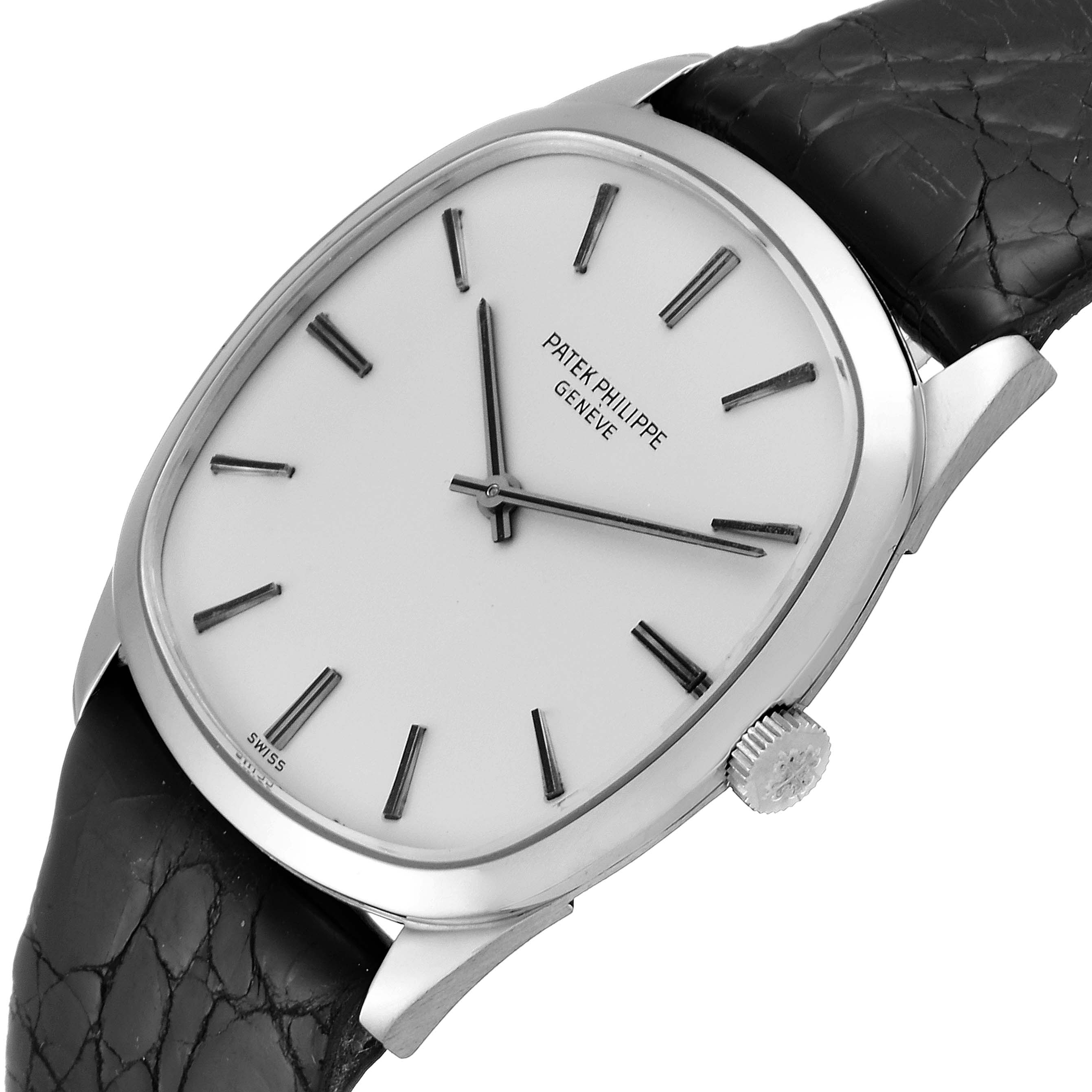 The image shows a Vintage Patek Philippe watch angled slightly to show the front face, crown, and part of the black leather strap.