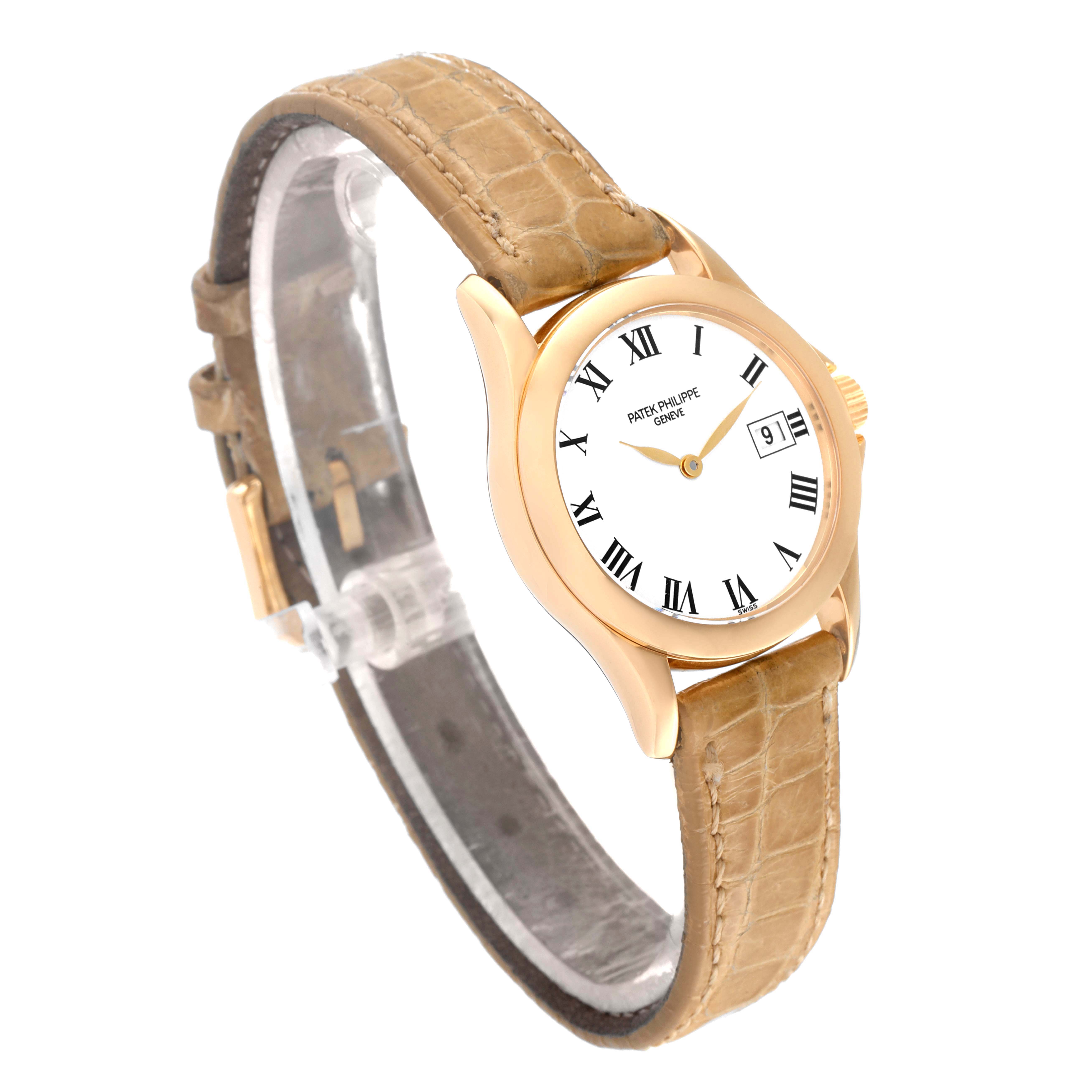 The image shows a Patek Philippe Calatrava 4906J-001 Women's Yellow Gold White Dial 4906J-001 Women's Yellow Gold White Dial watch from an angled side view, highlighting its face and strap.