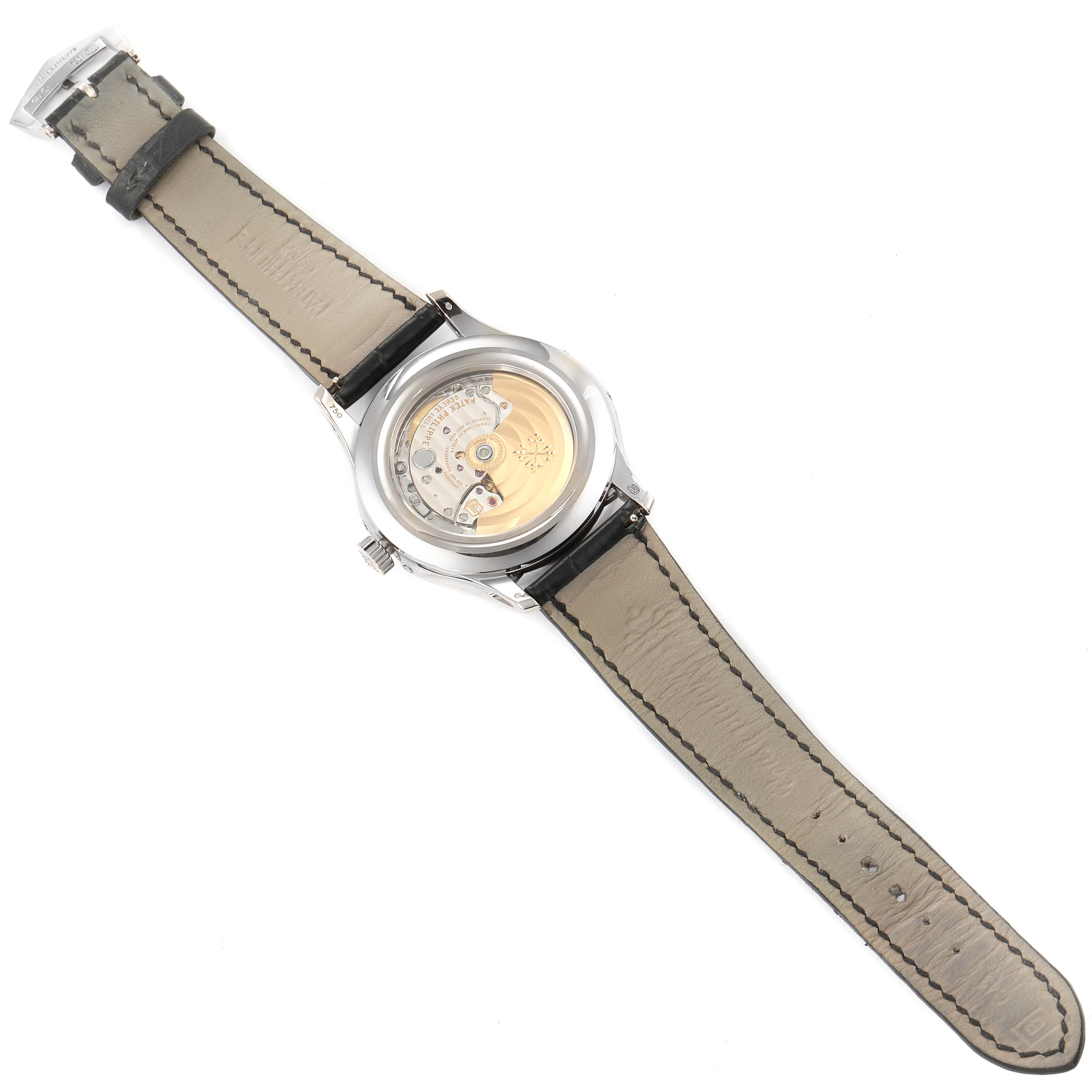 This image shows the back view of a Patek Philippe Complications 5205G  Men's White Gold Silver Dial 5205G  Men's White Gold Silver Dial watch, revealing its internal mechanism and leather strap.