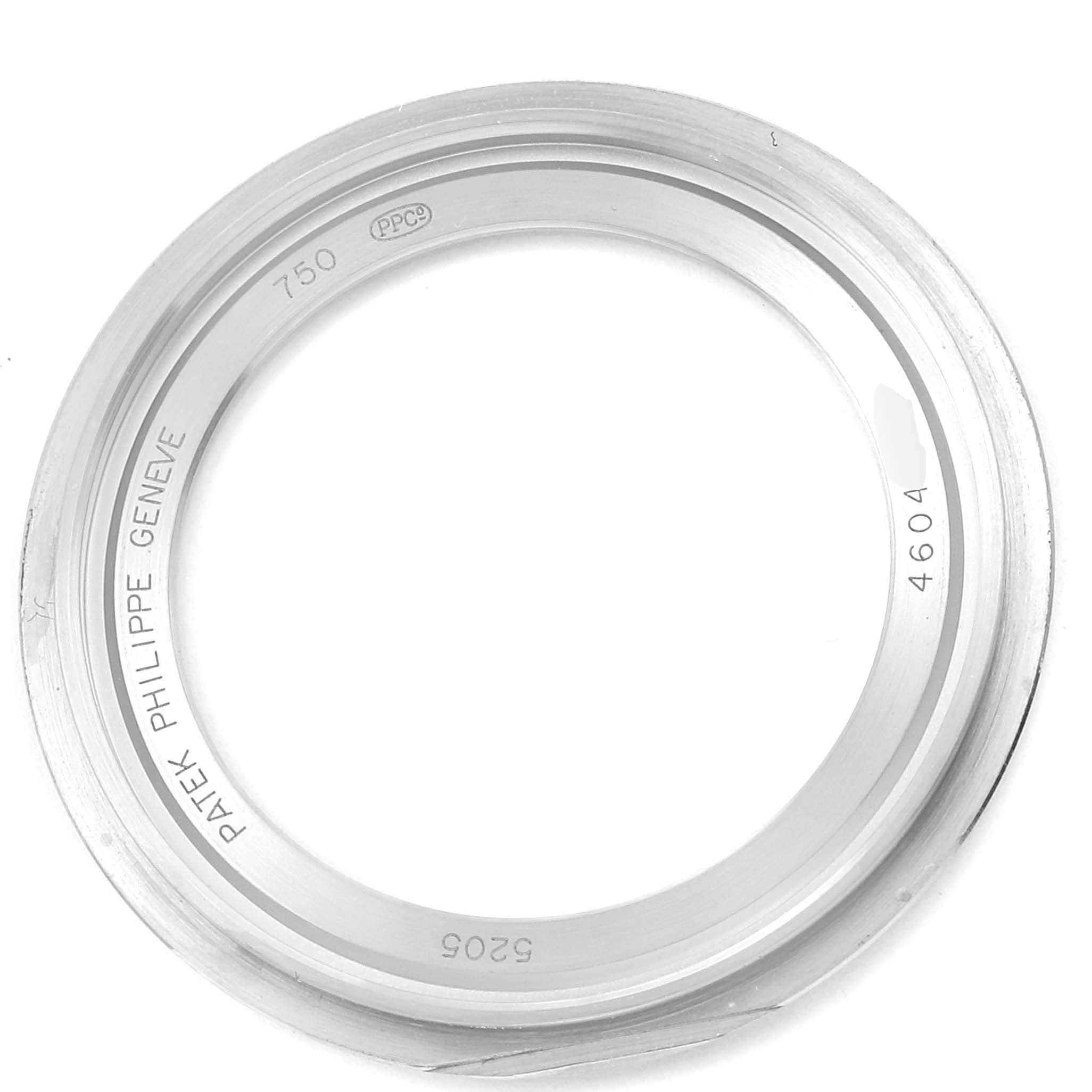 This image shows an upper view of the bezel for the Patek Philippe Complications 5205G  Men's White Gold Silver Dial 5205G  Men's White Gold Silver Dial model watch.