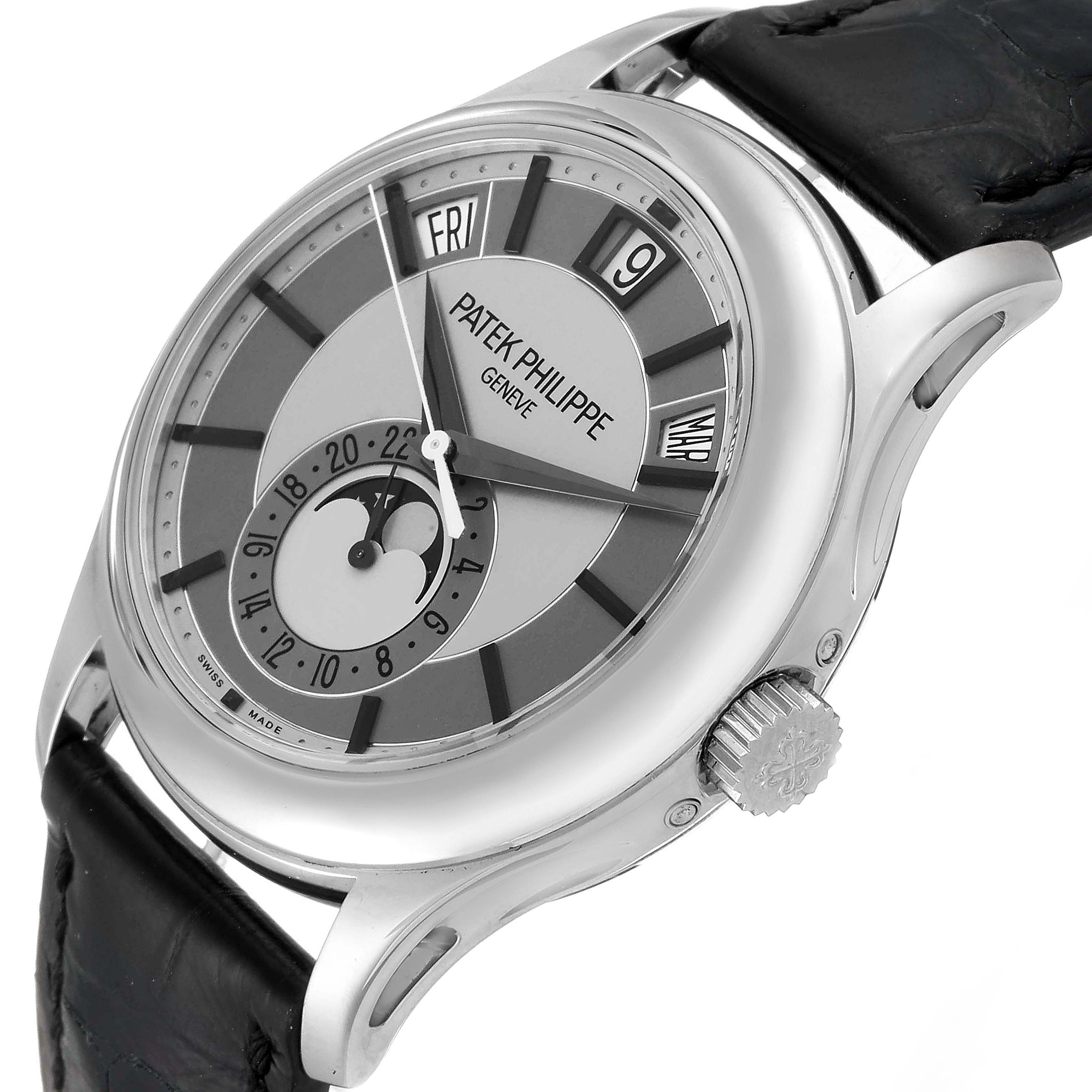 This image of the Patek Philippe Complications 5205G  Men's White Gold Silver Dial 5205G  Men's White Gold Silver Dial model watch shows a close-up of the front and right side angle, prominently displaying the dial and crown.