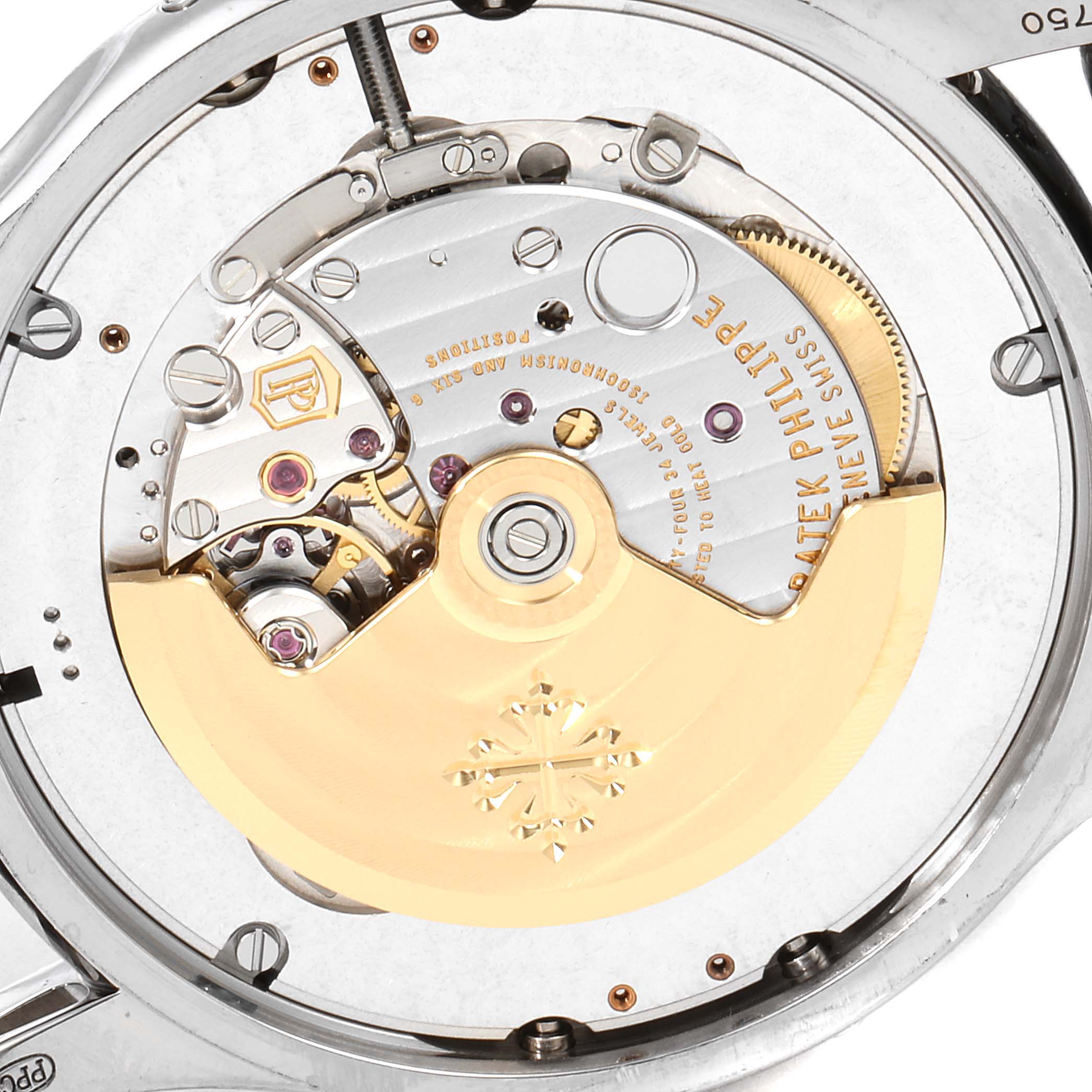 This image shows a close-up view of the intricate movement mechanism on the back of a Patek Philippe Complications 5205G  Men's White Gold Silver Dial 5205G  Men's White Gold Silver Dial watch.