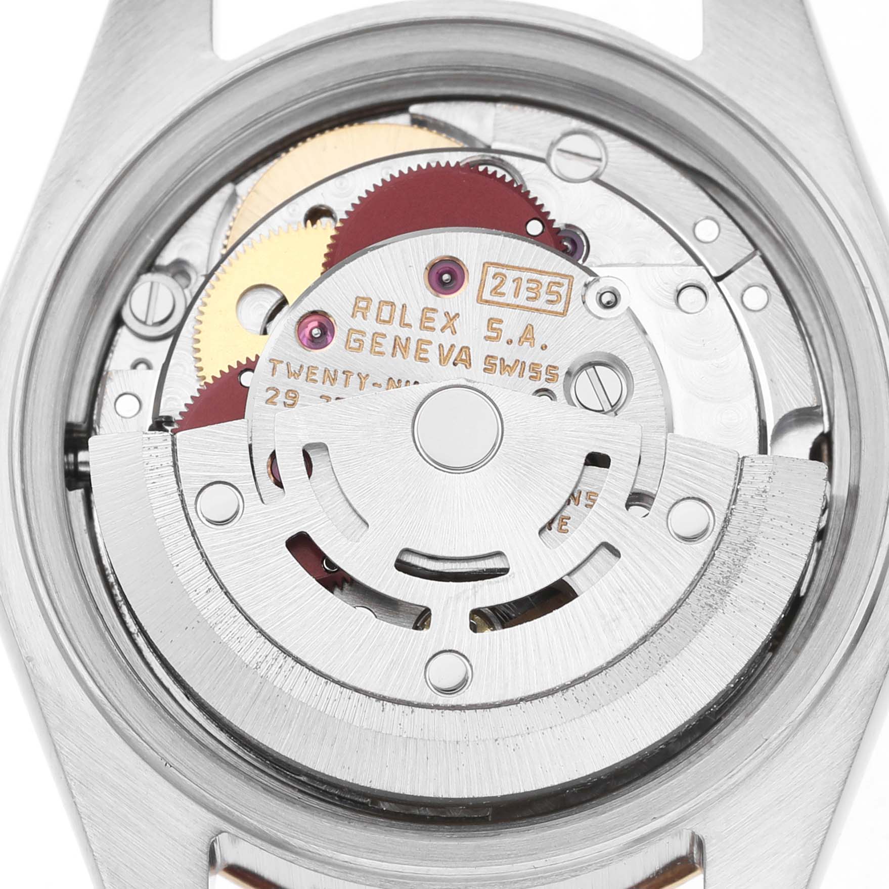 The image is a close-up of the movement inside a Rolex Datejust 69173 Women's Stainless Steel Champagne Dial watch, showing the rotor and gears from the back.