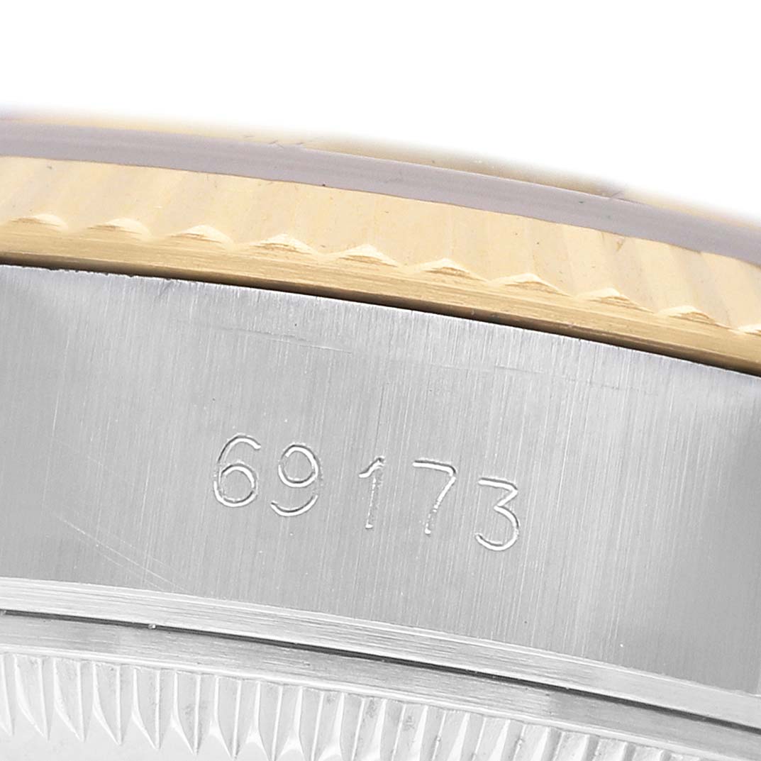 The image shows a close-up of the side of a Rolex Datejust 69173 Women's Stainless Steel Champagne Dial, featuring the bezel and model number engraving.