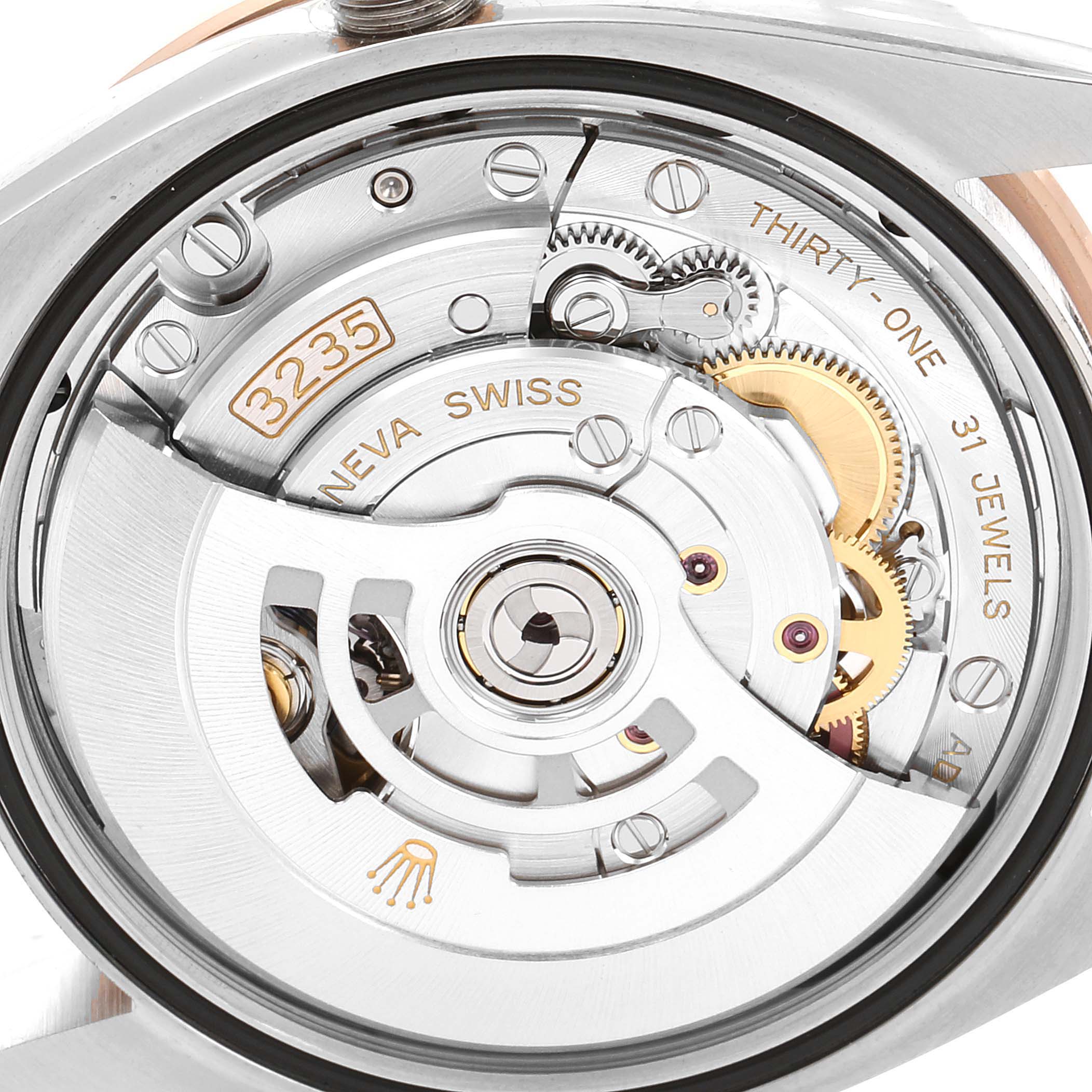 The image shows the inner mechanics and movement of a Rolex Datejust 126281 Men
s Steel and Gold (two tone) Grey Dial 126281 Men
s Steel and Gold (two tone) Grey Dial watch, viewed from the back.