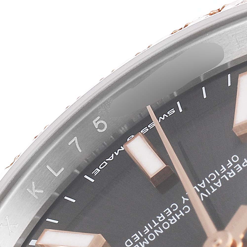 This image shows a close-up view of the dial and part of the bezel of a Rolex Datejust 126281 Men
s Steel and Gold (two tone) Grey Dial 126281 Men
s Steel and Gold (two tone) Grey Dial watch.
