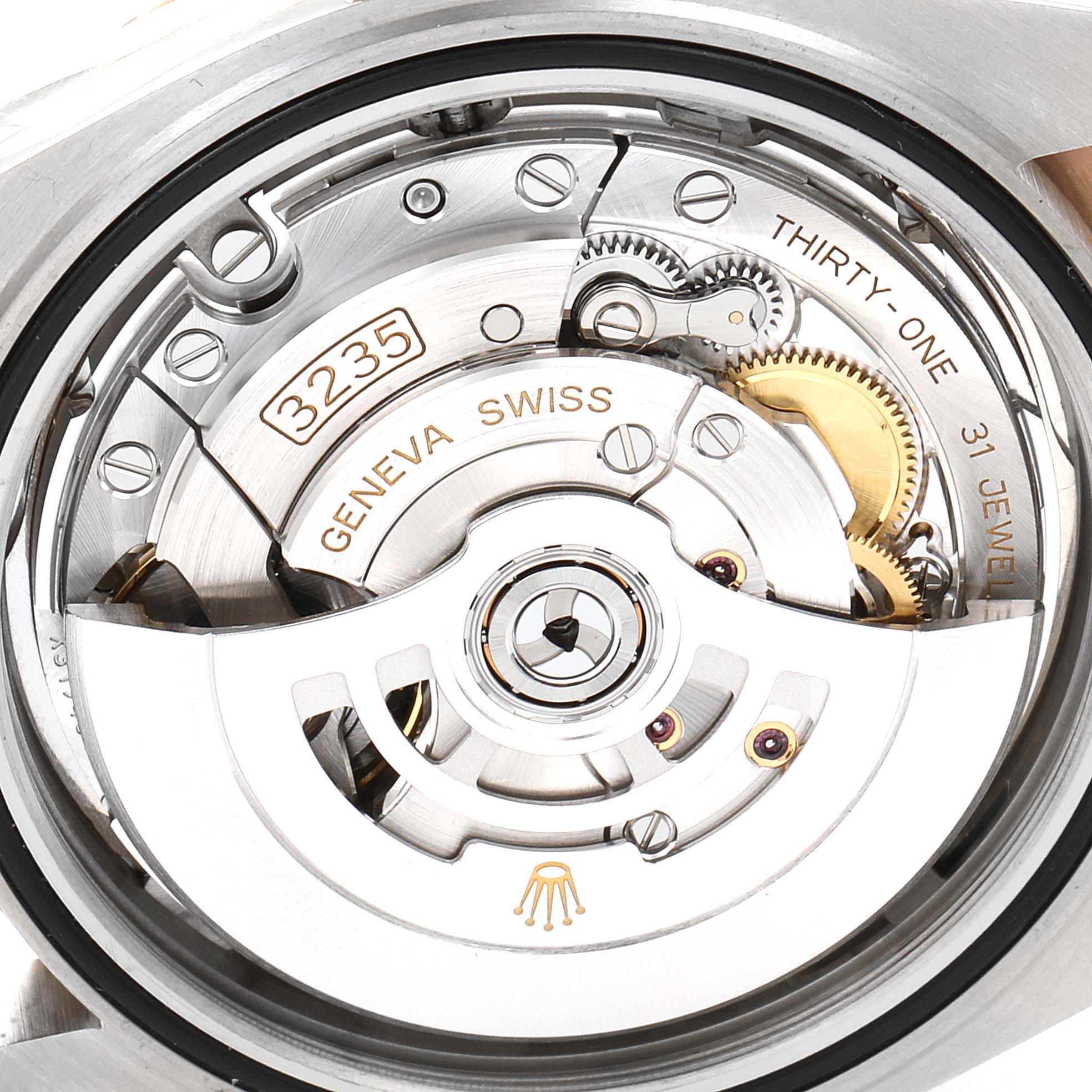 This image shows a detailed, close-up view of the movement inside a Rolex Datejust 41 126331 Men's Steel and Gold (two tone) Beige Dial 126331 Men's Steel and Gold (two tone) Beige Dial watch, including the balance wheel and engraved markings.