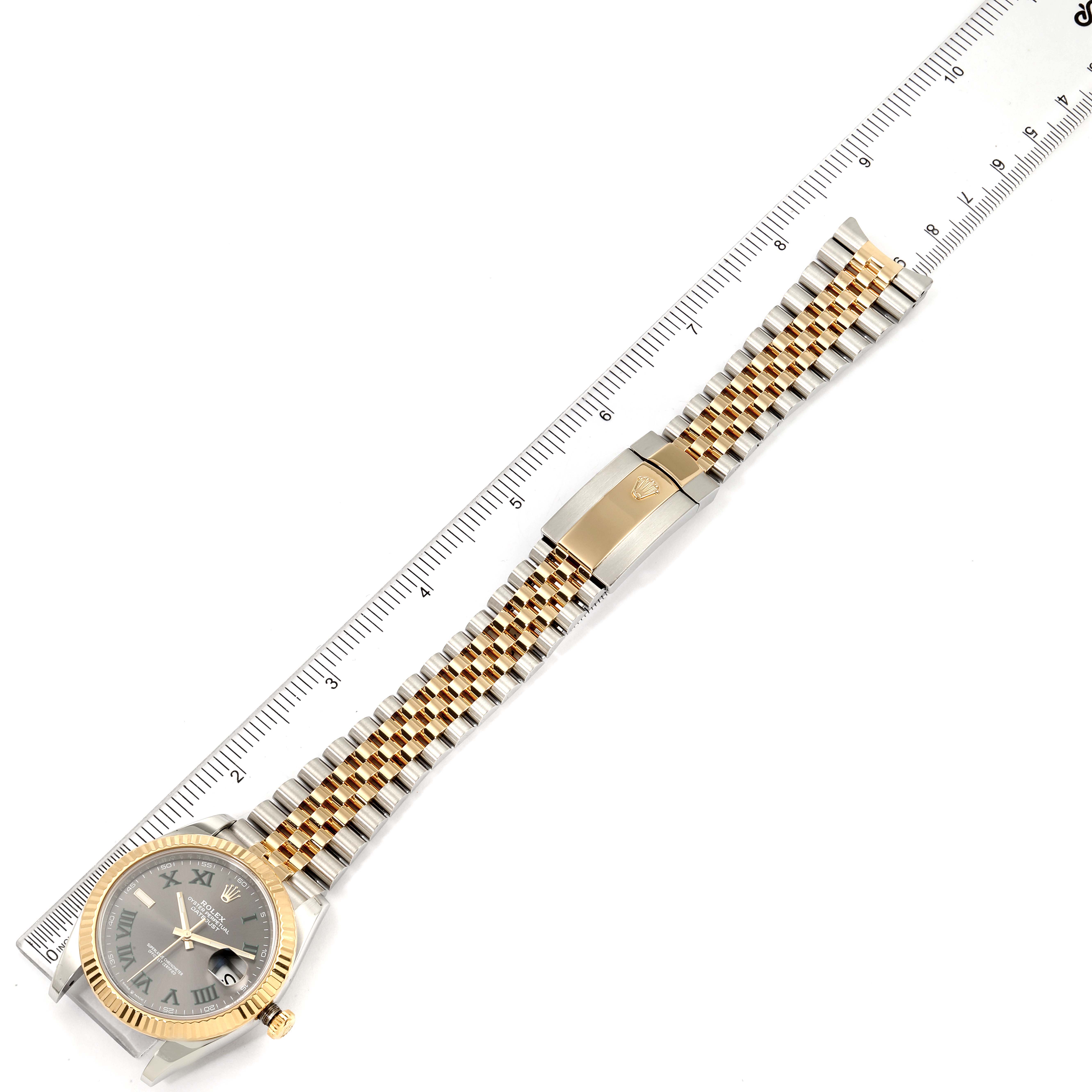 This image shows a Rolex Datejust 41 126333 Men
s Steel and Gold (two tone) Grey Dial 126333 Men
s Steel and Gold (two tone) Grey Dial watch laid flat with the face, band, and clasp visible next to a ruler for scale.