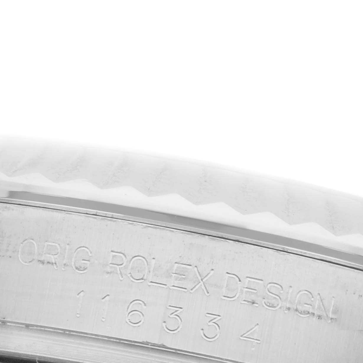 The image shows a close-up of the case edge with engraved text on the Rolex Datejust 41 116334 Men's Stainless Steel Silver Dial 116334 Men's Stainless Steel Silver Dial.