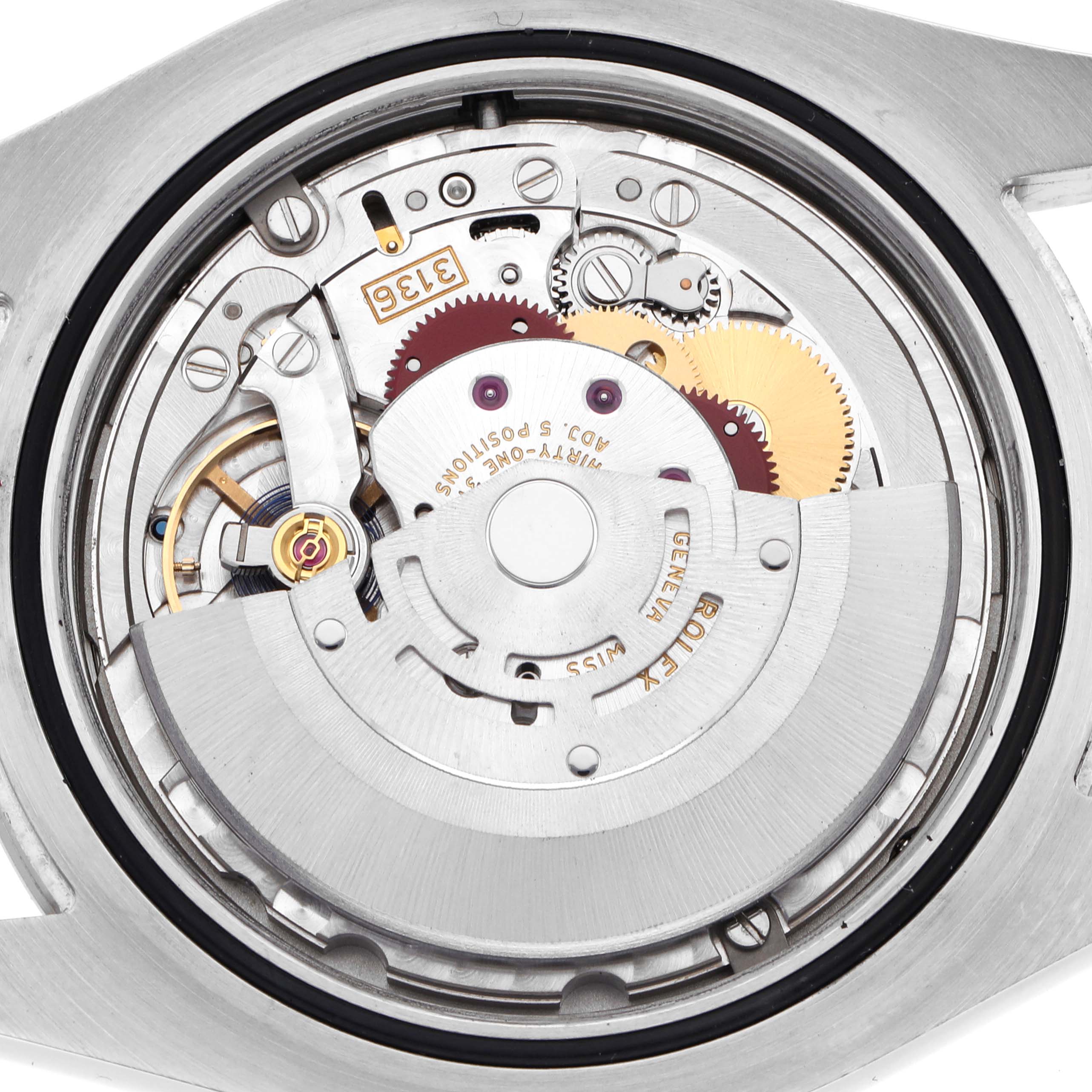 The image shows the movement of a Rolex Datejust 41 116334 Men's Stainless Steel Silver Dial 116334 Men's Stainless Steel Silver Dial watch from a back view, revealing its internal mechanical components.