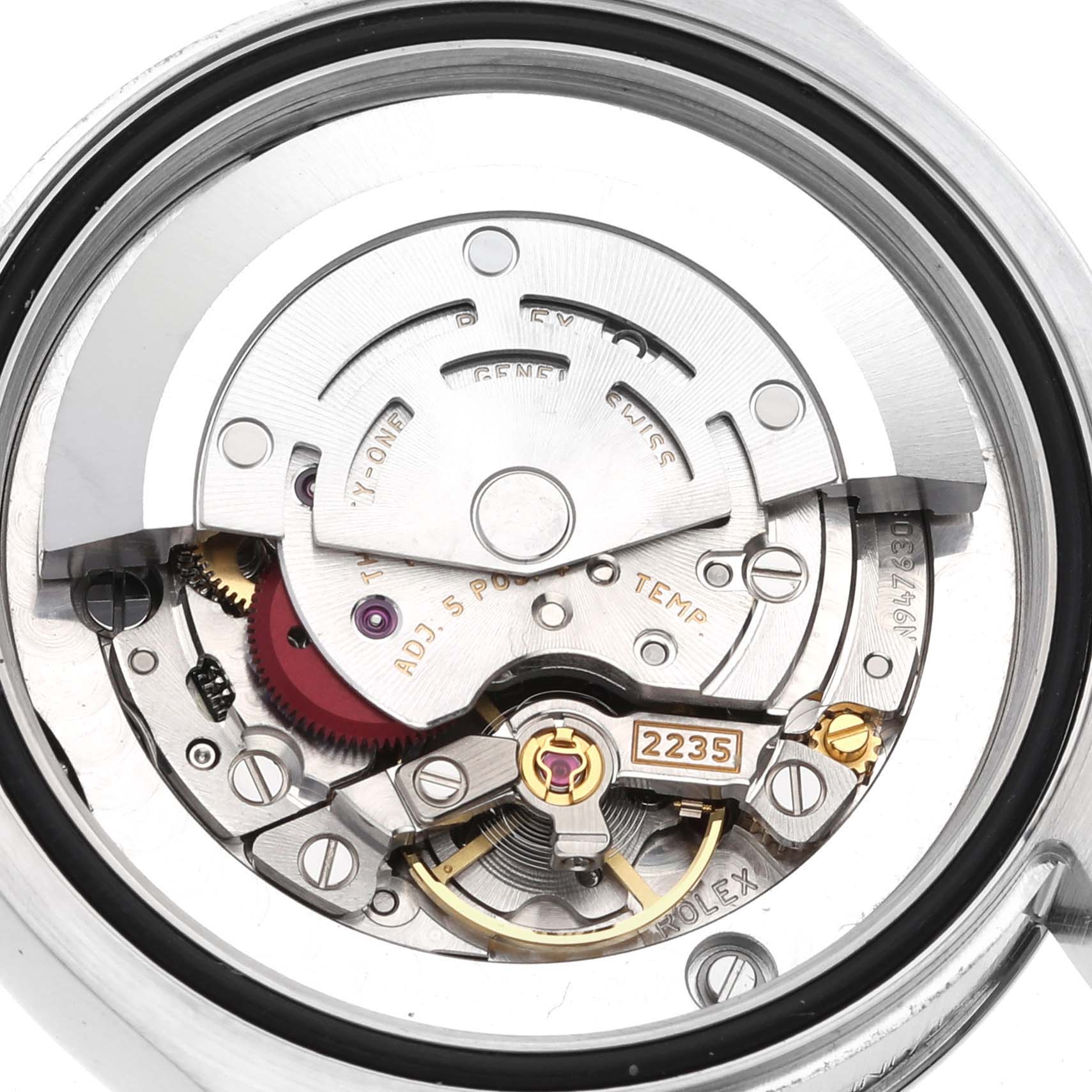 The image shows a close-up of the Rolex Mid-Size 178274 Women's Stainless Steel Black Dial 178274 Women's Stainless Steel Black Dial watch's internal movement mechanisms.