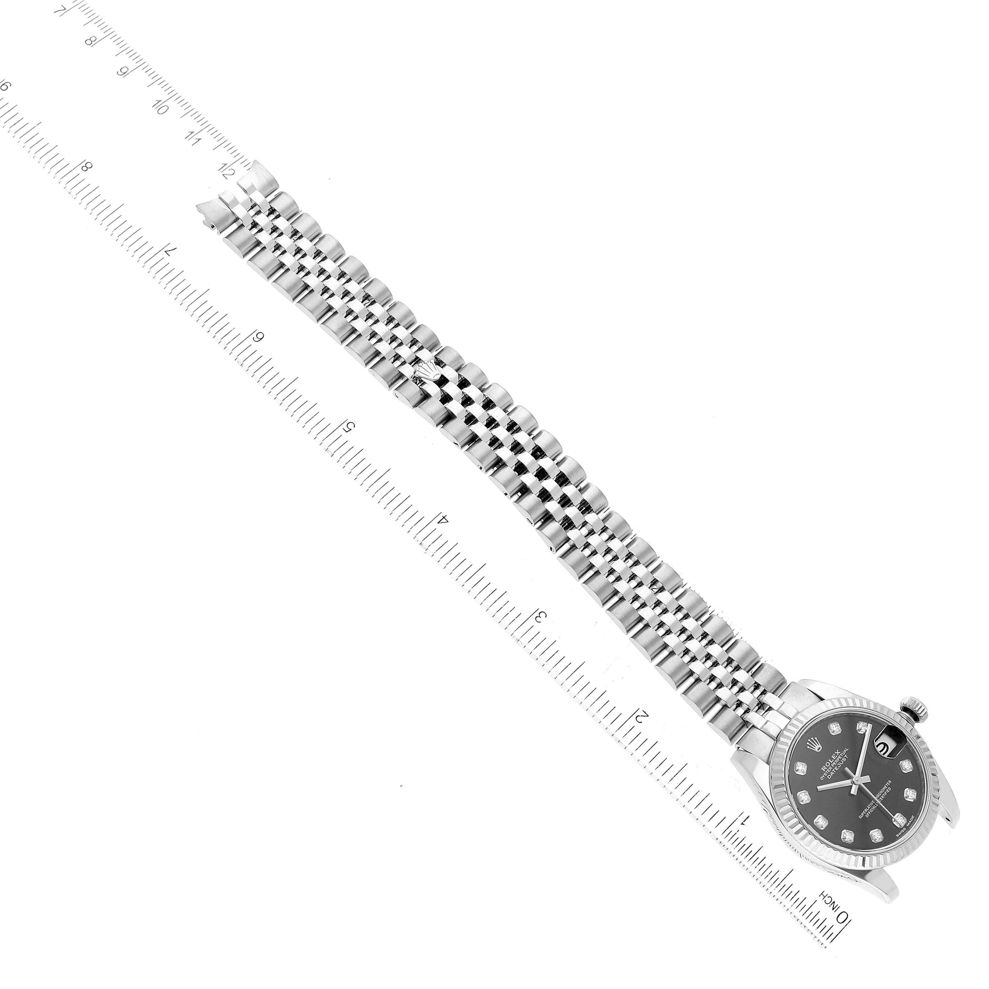 This top-down image shows the full Rolex Mid-Size 178274 Women's Stainless Steel Black Dial 178274 Women's Stainless Steel Black Dial watch, including its face, bezel, and metal bracelet.