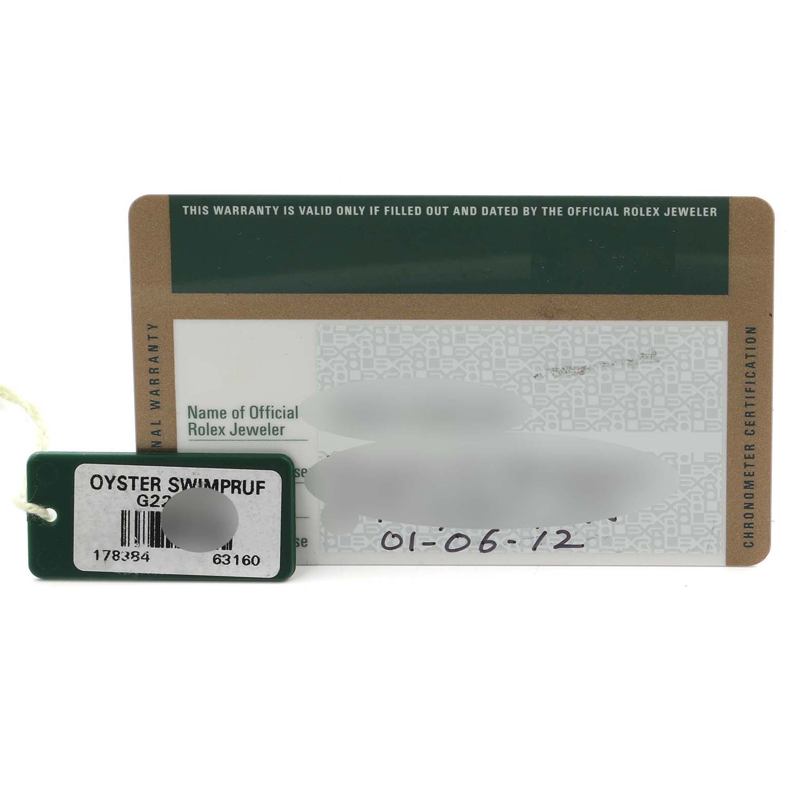 The image shows a Rolex Mid-Size 178384 Women's Stainless Steel Mother of Pearl Dial 178384 Women's Stainless Steel Mother of Pearl Dial model warranty card and a green tag accessory.