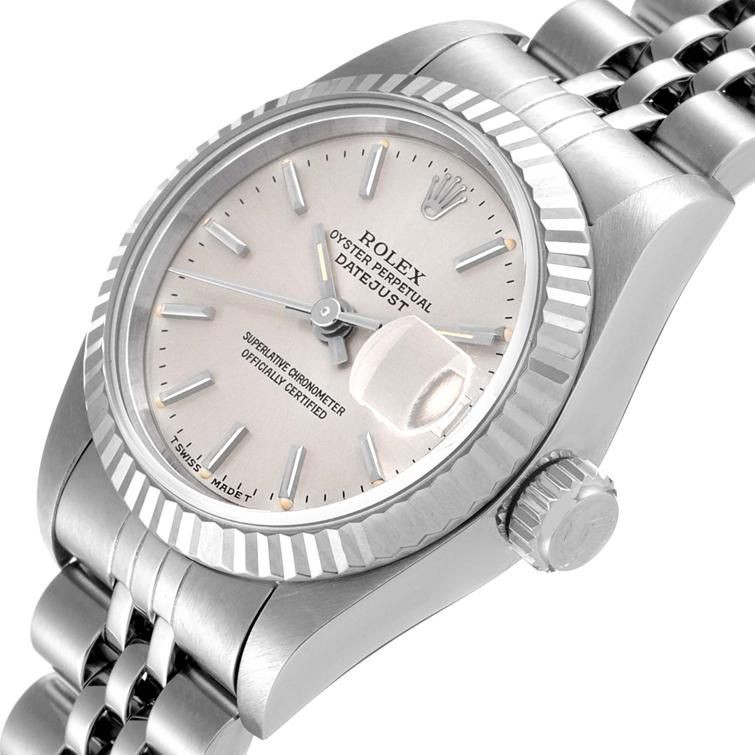 The image shows a close-up angle of the Rolex Datejust 69174 Women
s Stainless Steel Silver Dial 69174 Women
s Stainless Steel Silver Dial watch face, crown, and part of the bracelet.