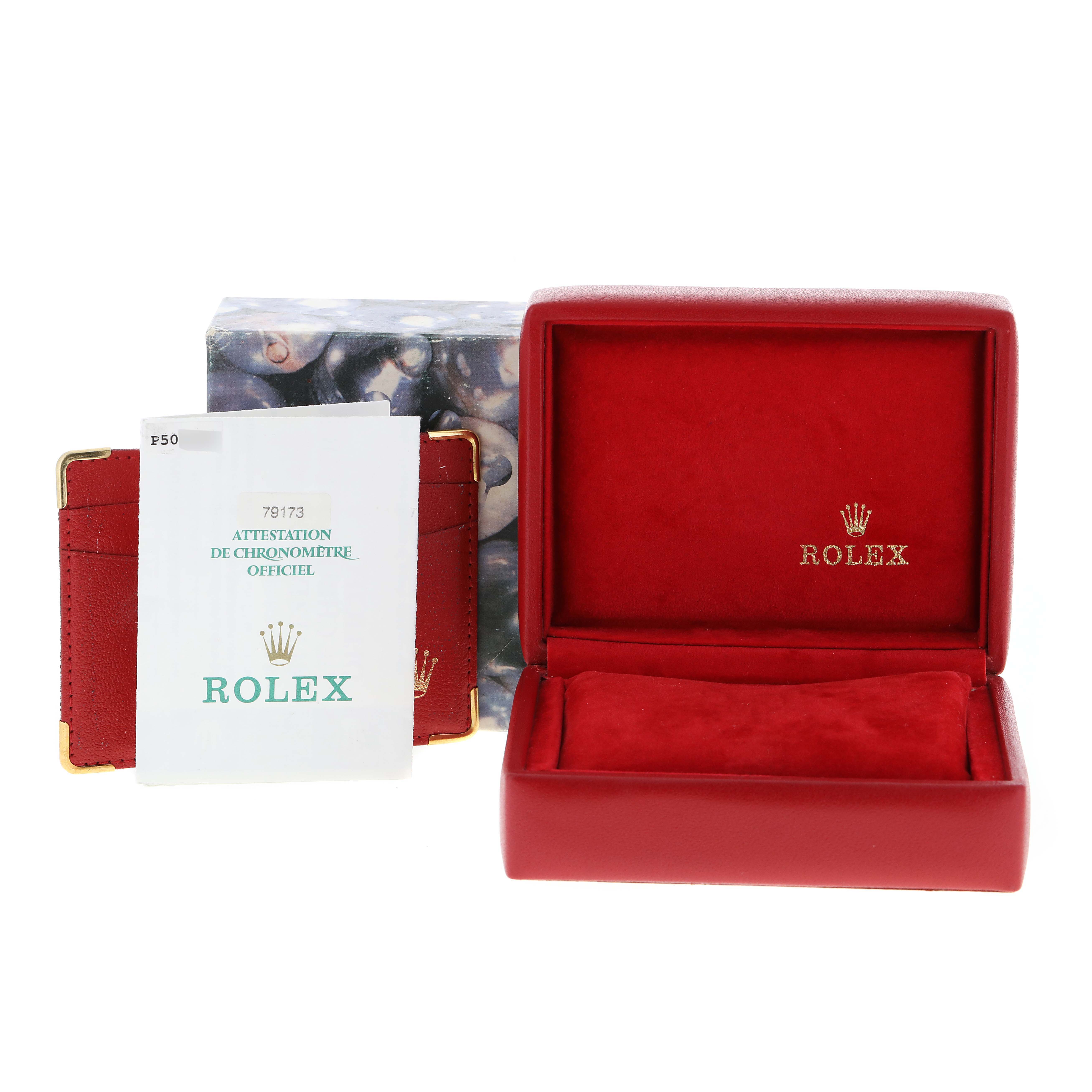 The image shows a red Rolex box and papers for the Datejust model.