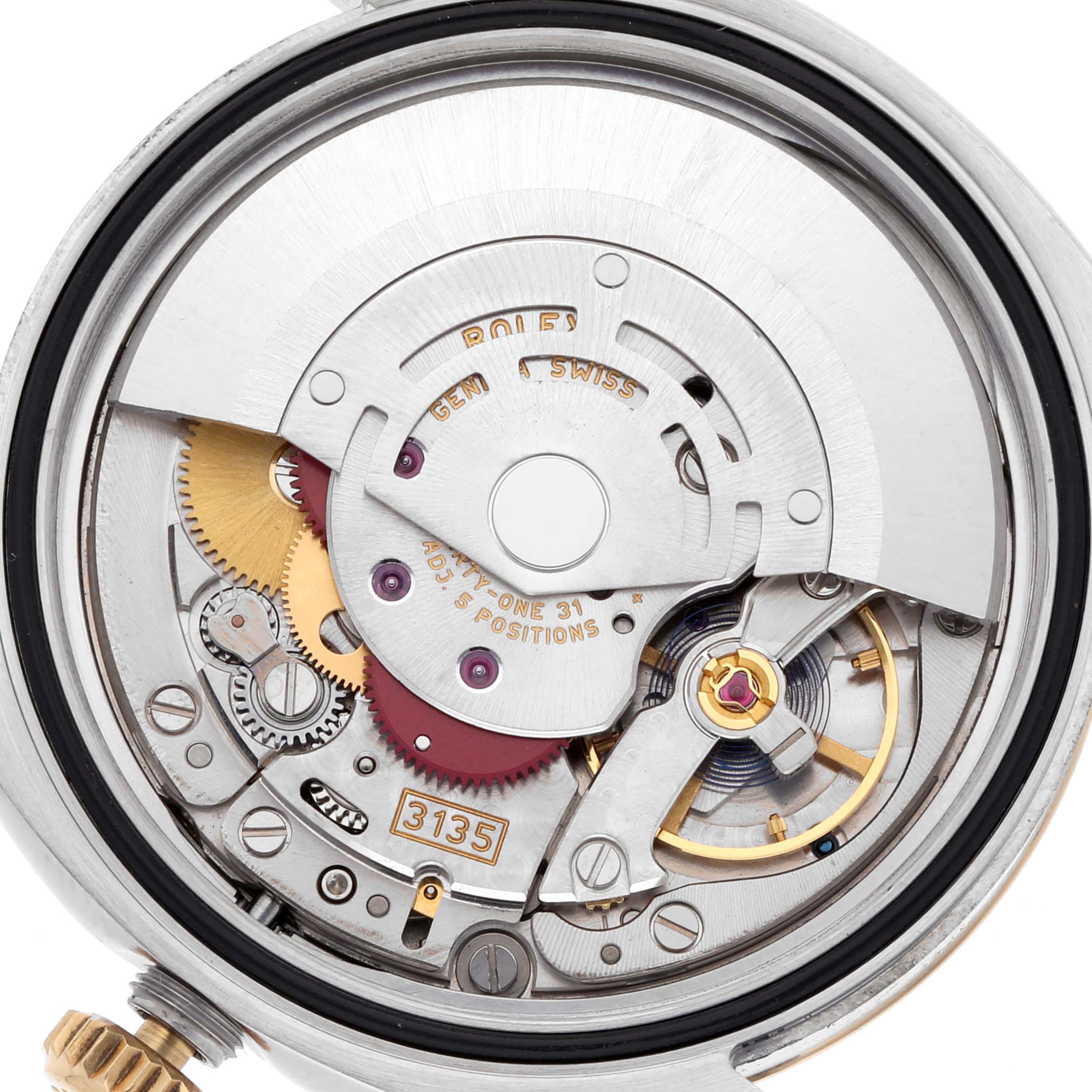 This image shows the movement of a Rolex Datejust 116233 Men's Steel and Gold (two tone) Champagne Dial 116233 Men's Steel and Gold (two tone) Champagne Dial, highlighting gears, the rotor, and other intricate internal components.