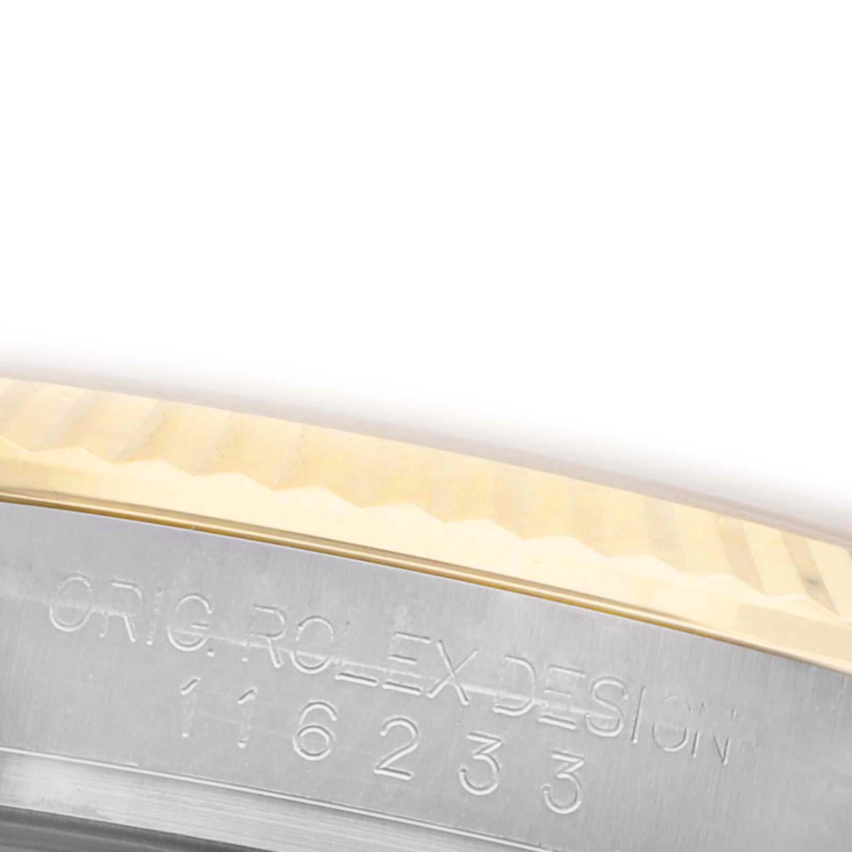 The image shows a close-up of the side engraving on the bezel of a Rolex Datejust 116233 Men's Steel and Gold (two tone) Champagne Dial 116233 Men's Steel and Gold (two tone) Champagne Dial watch.