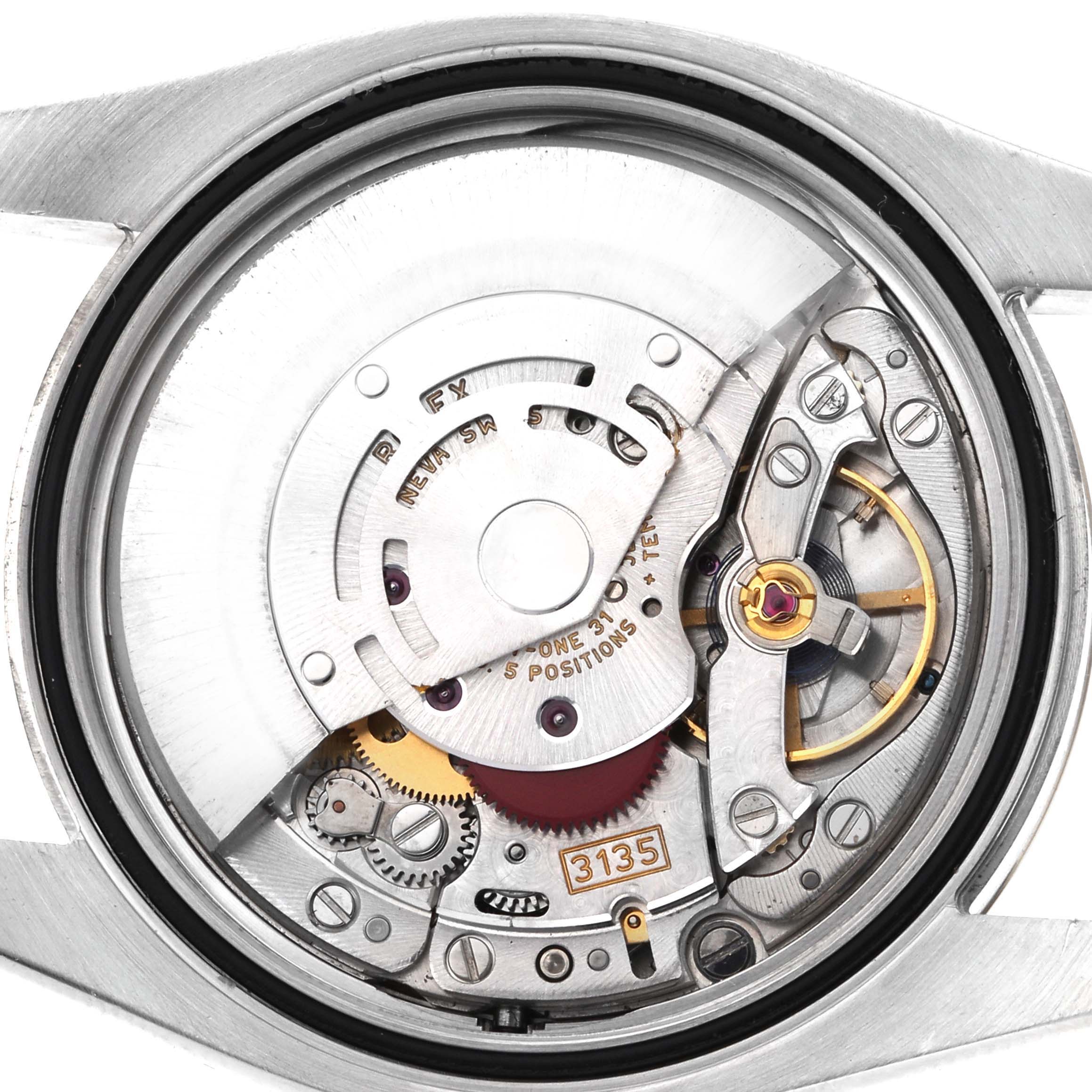 The image shows a top-down view of the Rolex Datejust 116233 Men's Steel and Gold (two tone) Champagne Dial 116233 Men's Steel and Gold (two tone) Champagne Dial's movement, highlighting the intricate internal components.