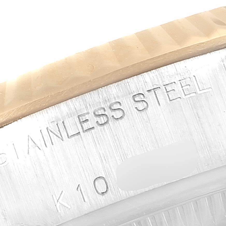 This image shows a close-up of the side engraving on the stainless steel case of a Rolex Datejust 79173 Women's Steel and Gold (two tone) Mother of Pearl Dial 79173 Women's Steel and Gold (two tone) Mother of Pearl Dial watch.