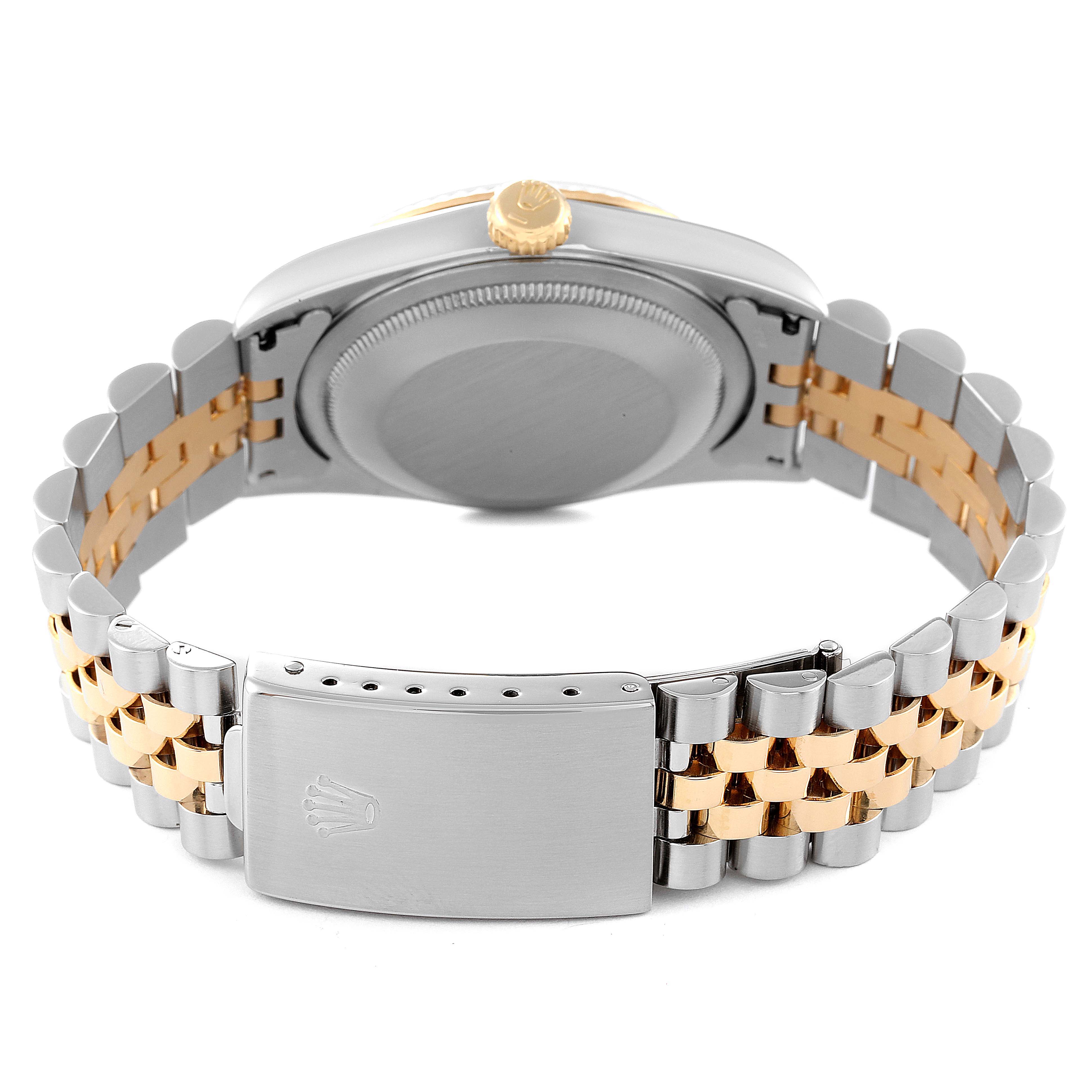 The image shows the back view of a Rolex Datejust 16233 Men's Steel and Gold (two tone) Blue Dial 16233 Men's Steel and Gold (two tone) Blue Dial, highlighting the case back, crown, and two-tone bracelet clasp.