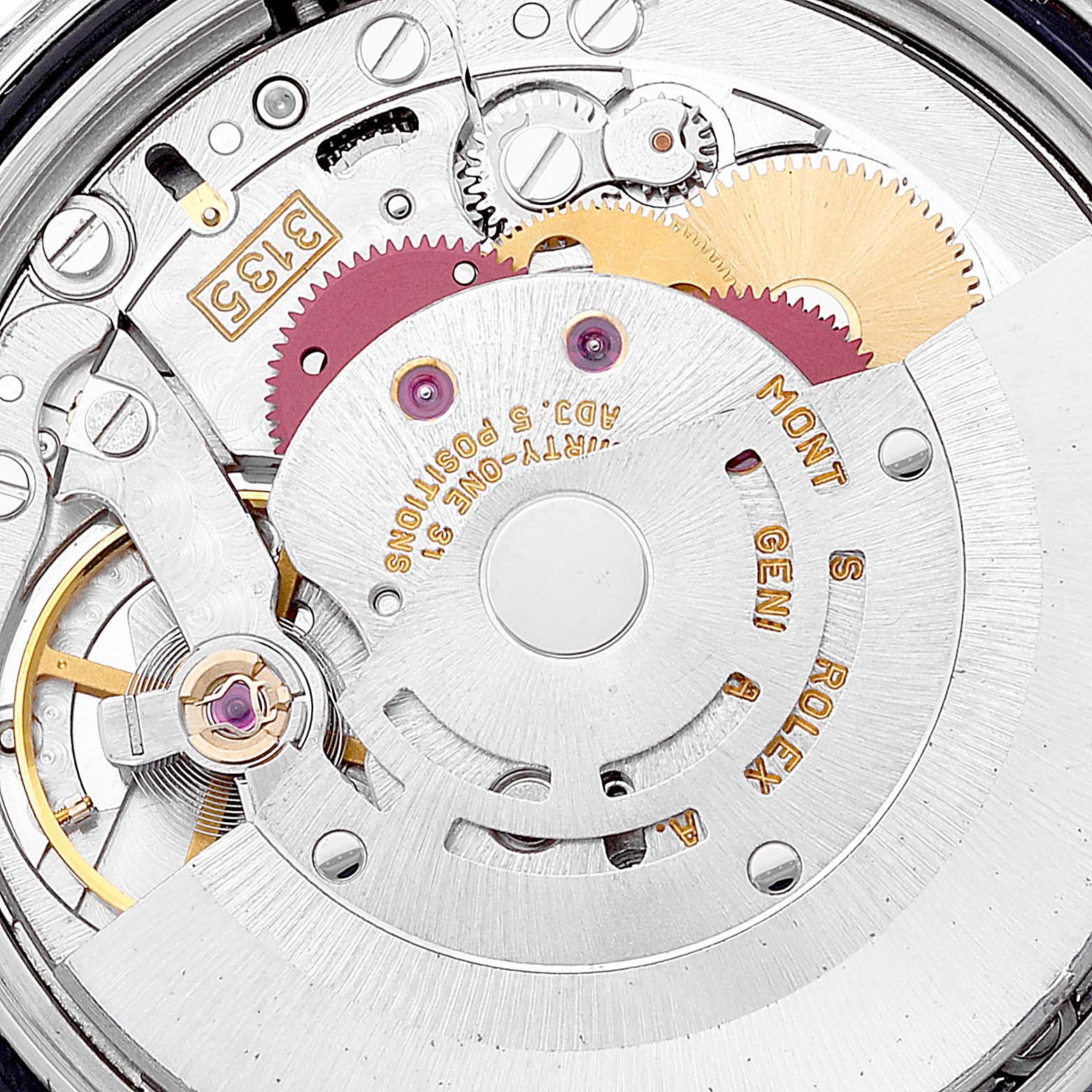 Close-up of the Rolex Datejust 16233 Men's Steel and Gold (two tone) Blue Dial 16233 Men's Steel and Gold (two tone) Blue Dial watch movement, showing gears, rotor, and inscriptions.
