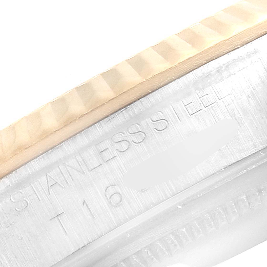 The image shows a close-up of the side of a Rolex Datejust 16233 Men's Steel and Gold (two tone) White Dial 16233 Men's Steel and Gold (two tone) White Dial watch, highlighting its fluted bezel and stainless steel case.