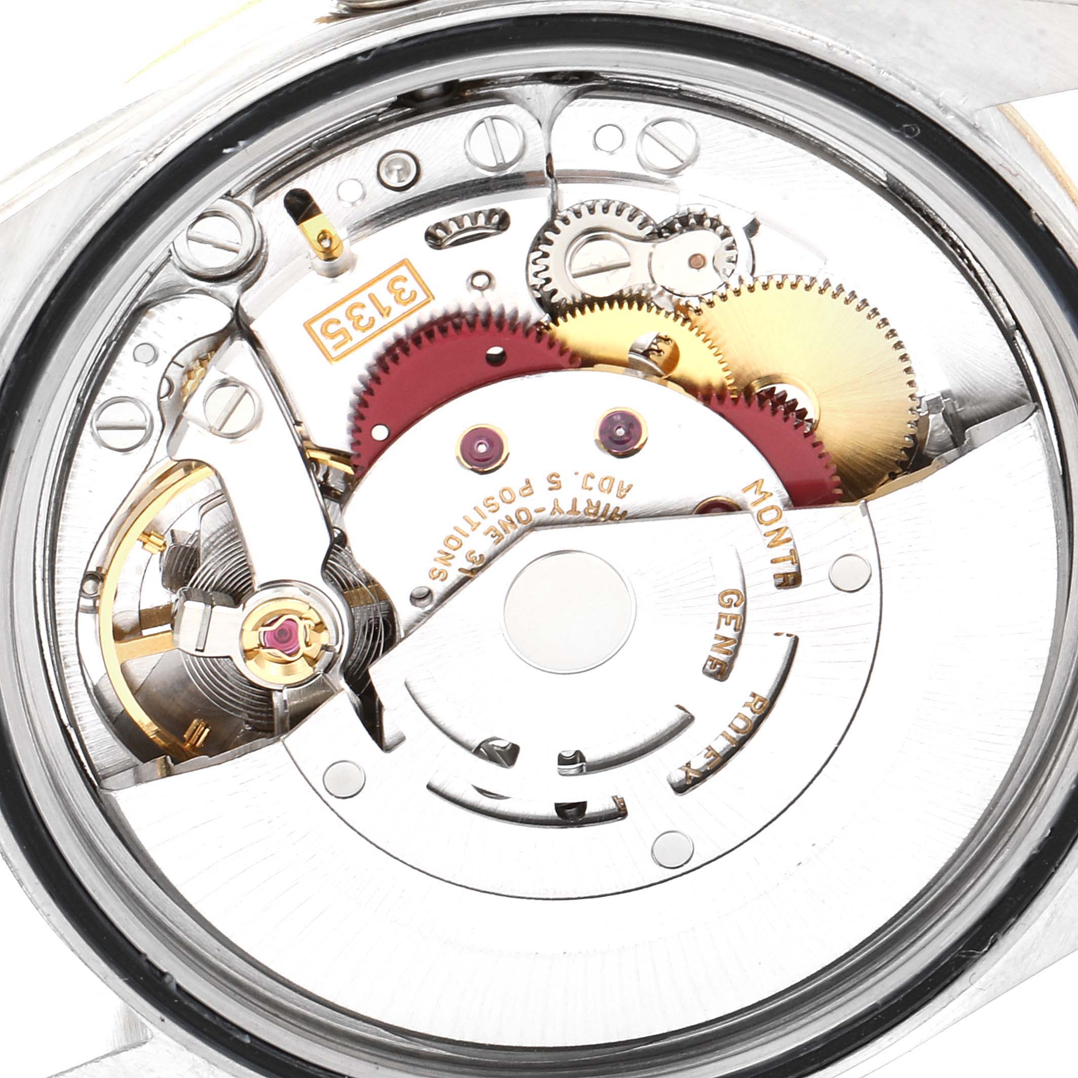 This image shows the intricate inner mechanics of the Rolex Datejust 16233 Men's Steel and Gold (two tone) White Dial 16233 Men's Steel and Gold (two tone) White Dial watch, focusing on gears and movement components.