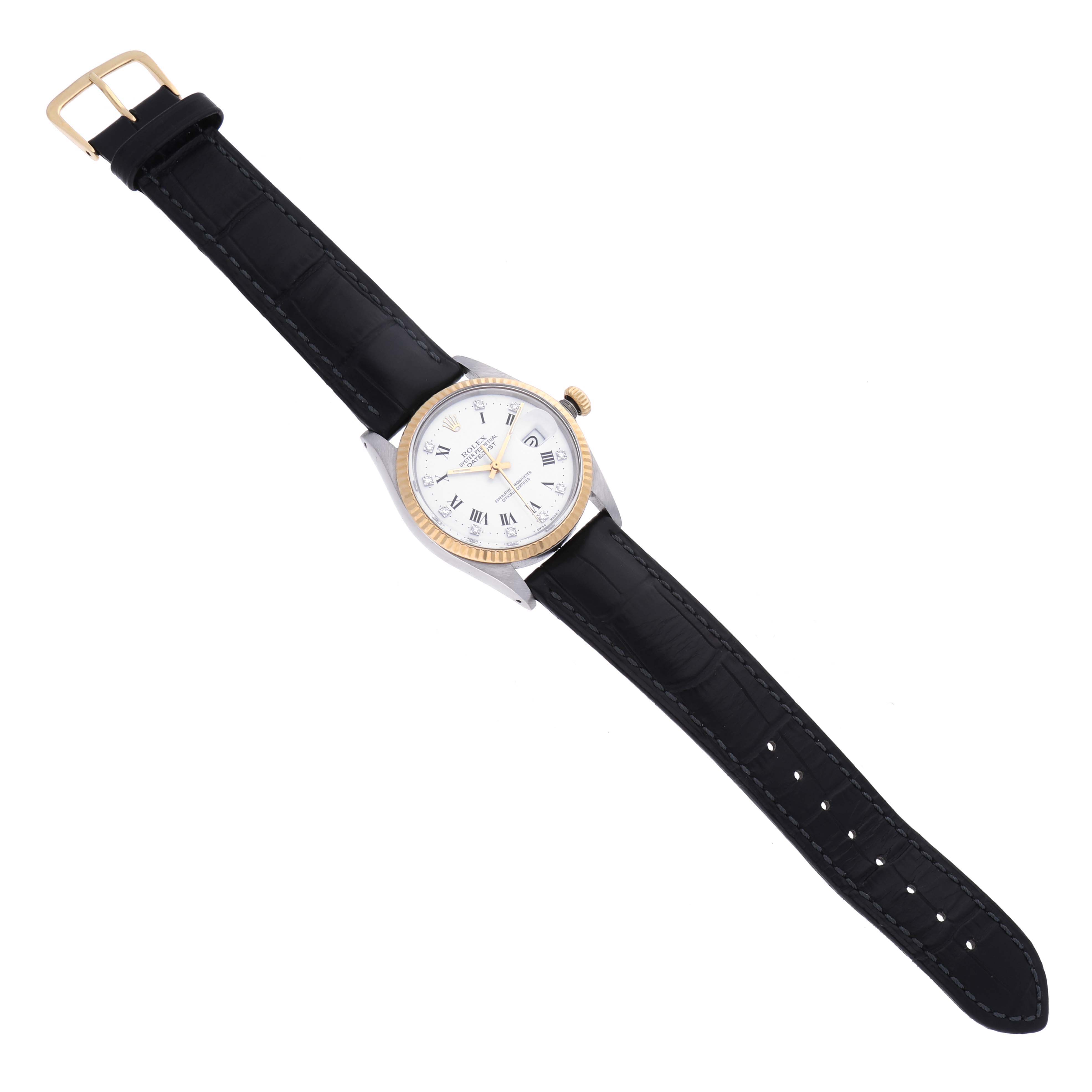 The Rolex Datejust 16013 Men's Steel and Gold (two tone) White Dial 16013 Men's Steel and Gold (two tone) White Dial watch is shown from a top-down angle, highlighting its face, bezel, and black leather strap.