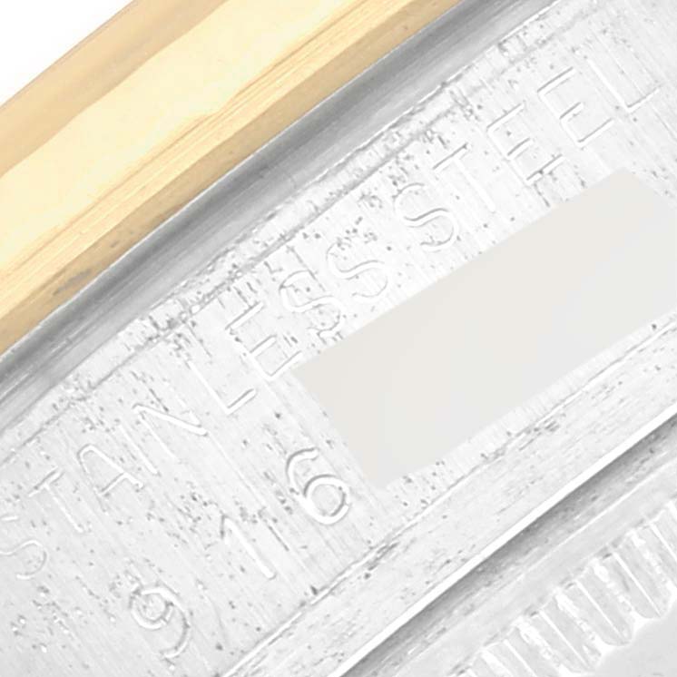 The image shows a close-up of the side of the bezel and part of the case back of a Rolex Datejust 16013 Men's Steel and Gold (two tone) White Dial 16013 Men's Steel and Gold (two tone) White Dial, highlighting the "STAINLESS STEEL" engraving.