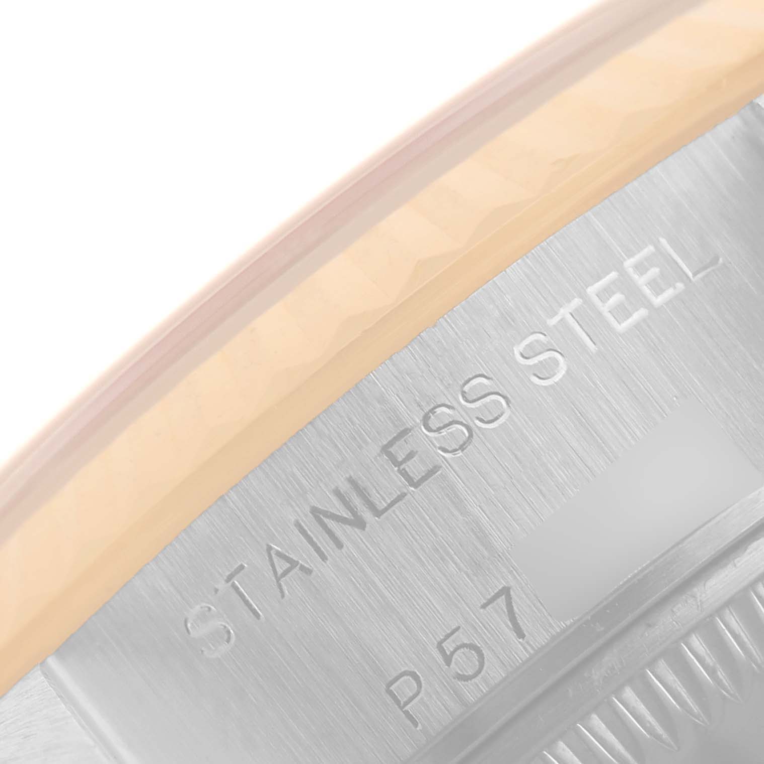 This image shows a close-up angle of the case back edge of a Rolex Datejust 79173 Women
s Steel and Gold (two tone) White Dial 79173 Women
s Steel and Gold (two tone) White Dial watch, highlighting the "Stainless Steel" engraving.