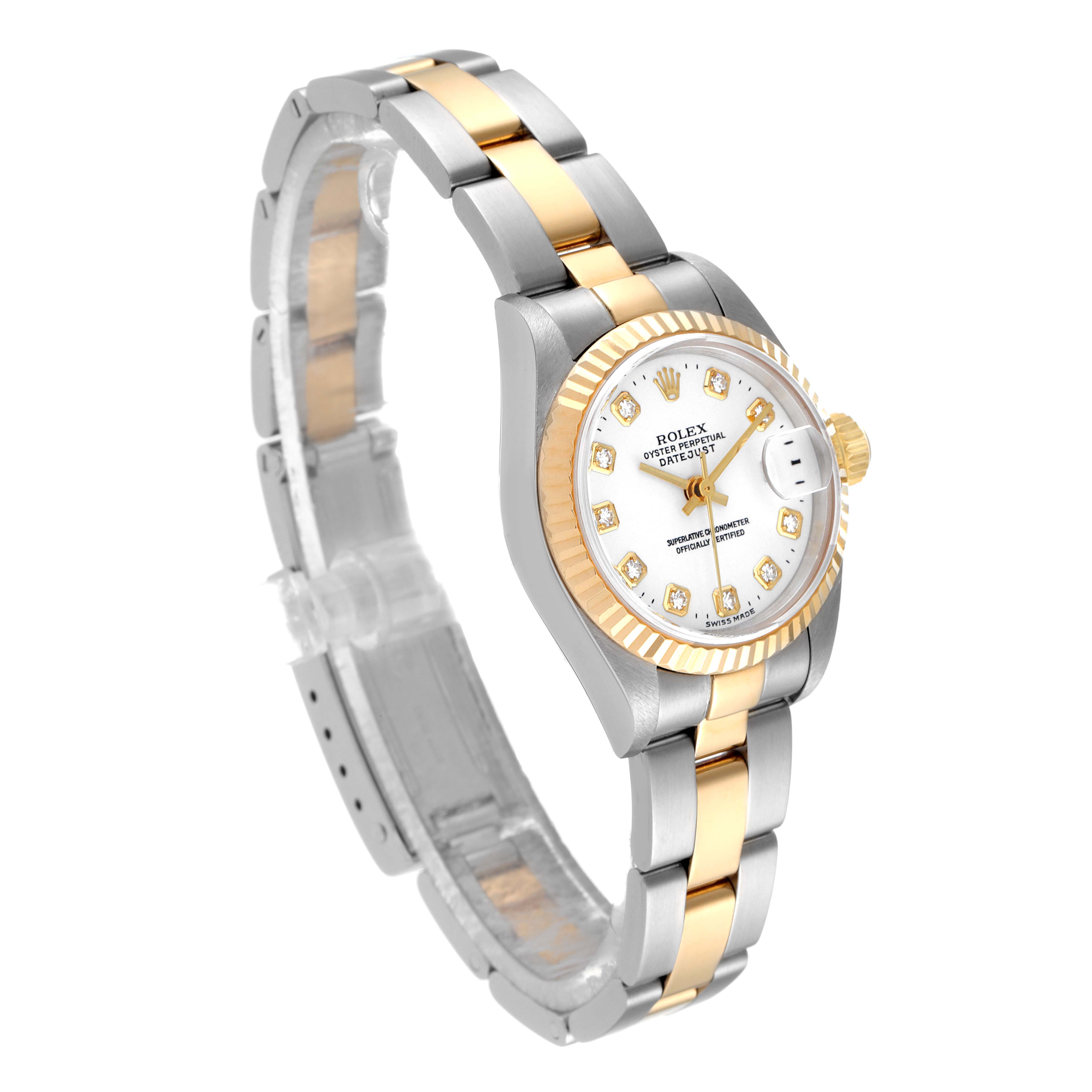 This Rolex Datejust 79173 Women
s Steel and Gold (two tone) White Dial 79173 Women
s Steel and Gold (two tone) White Dial watch is shown at a three-quarter angle, highlighting its two-tone bracelet, fluted bezel, and diamond hour markers.