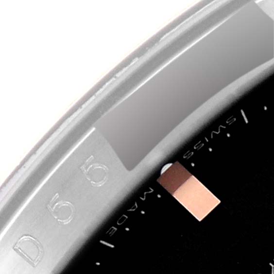 The image shows a close-up of the bezel and part of the dial of a Rolex Turn-o-Graph 116261 Men's Steel and Gold (two tone) Black Dial 116261 Men's Steel and Gold (two tone) Black Dial watch.