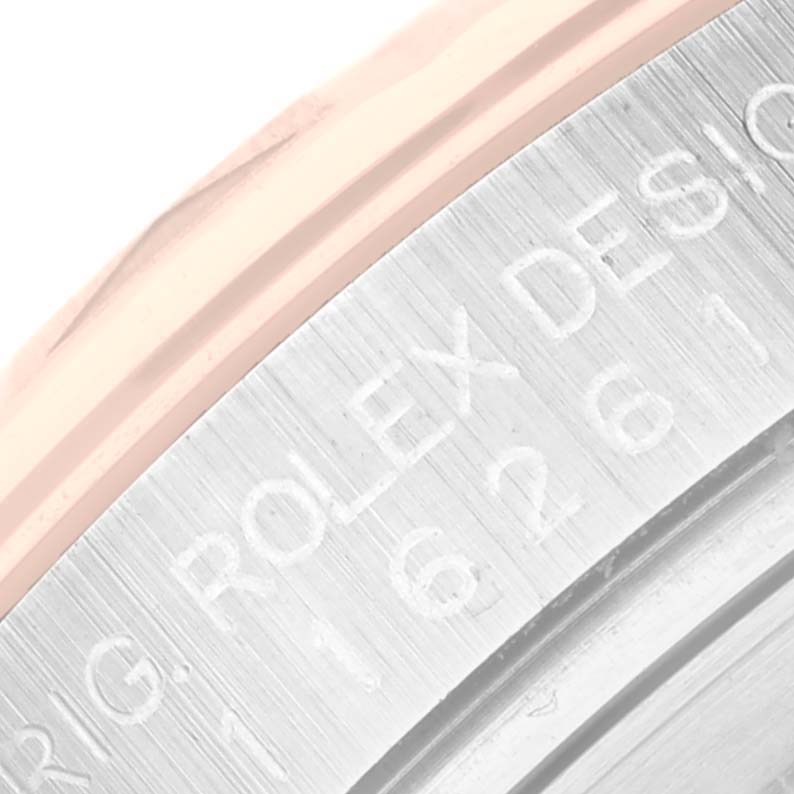 The image shows a close-up of the side of a Rolex Turn-o-Graph 116261 Men's Steel and Gold (two tone) Black Dial 116261 Men's Steel and Gold (two tone) Black Dial, focusing on the engraved serial and model information.