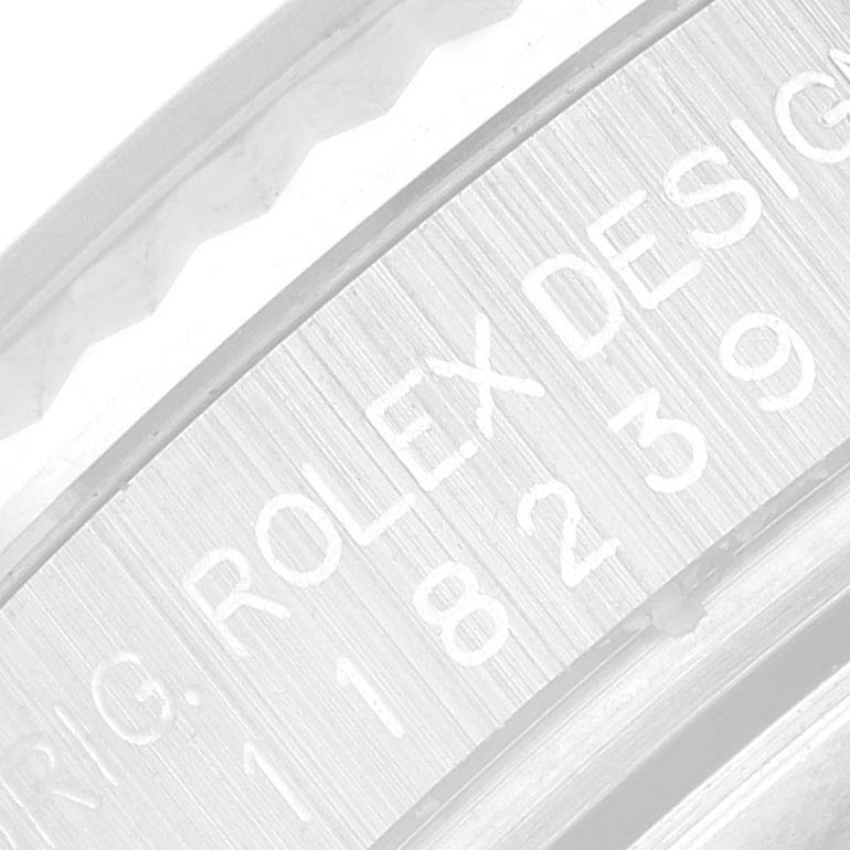 The image shows a close-up of the side engraving on a Rolex President 118239 Men's White Gold Silver Dial 118239 Men's White Gold Silver Dial model watch, highlighting the "ROLEX DESIGN" and model number.