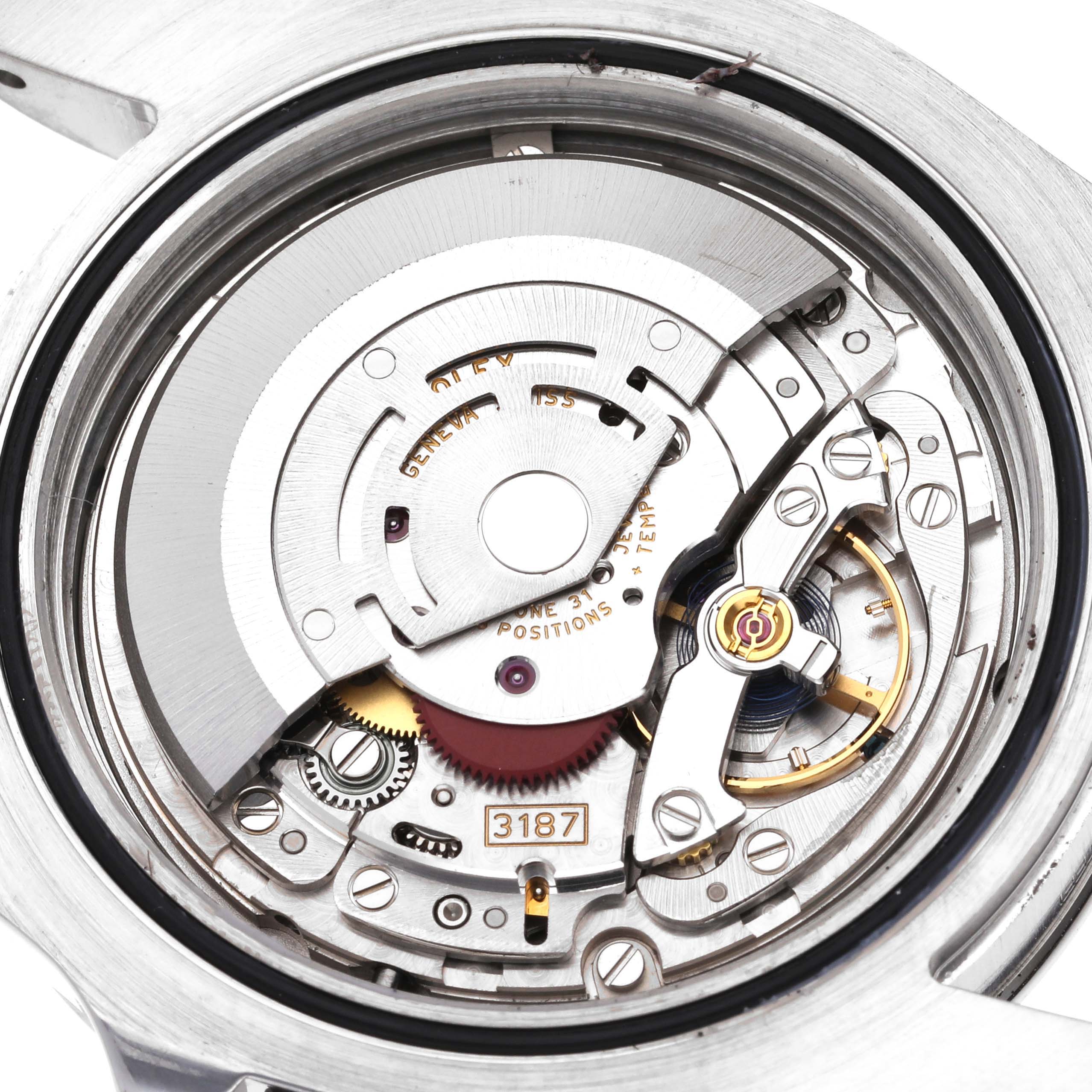 The image shows the internal mechanism of a Rolex Explorer 216570 Men's Stainless Steel Black Dial 216570 Men's Stainless Steel Black Dial watch at a close-up angle, revealing its intricate gears and components.