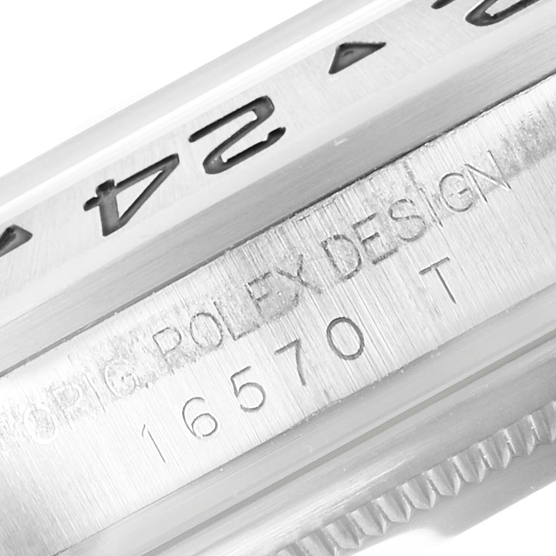 The image shows a close-up angle focusing on the bezel and engraved model number of the Rolex Explorer 16570 Men's Stainless Steel White Dial 16570 Men's Stainless Steel White Dial watch.