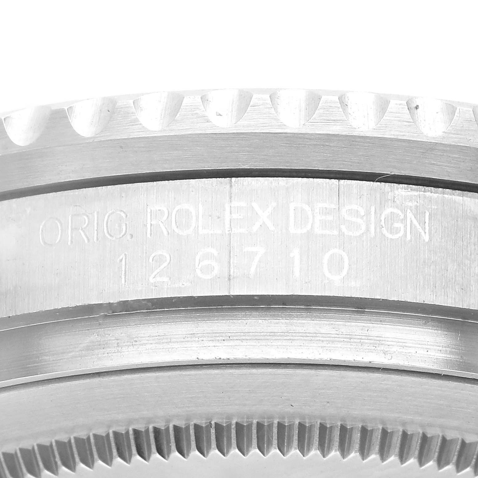 This close-up image of a Rolex GMT-Master 126710BLNR Men
s Stainless Steel Black Dial 126710BLNR Men
s Stainless Steel Black Dial watch shows the engraved model number "126710" and part of the bezel.