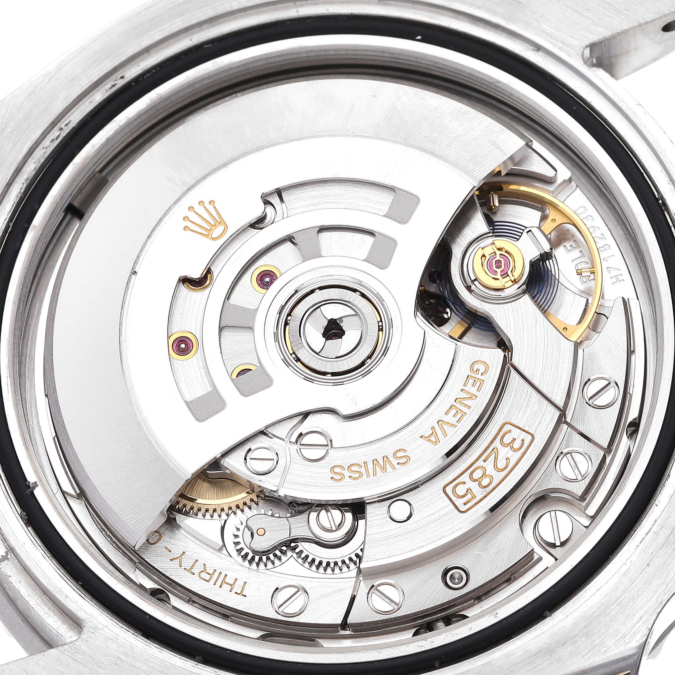 This image shows the intricate internal movement of the Rolex GMT-Master 126710BLNR Men
s Stainless Steel Black Dial 126710BLNR Men
s Stainless Steel Black Dial watch, focusing on the rotor and gear components.