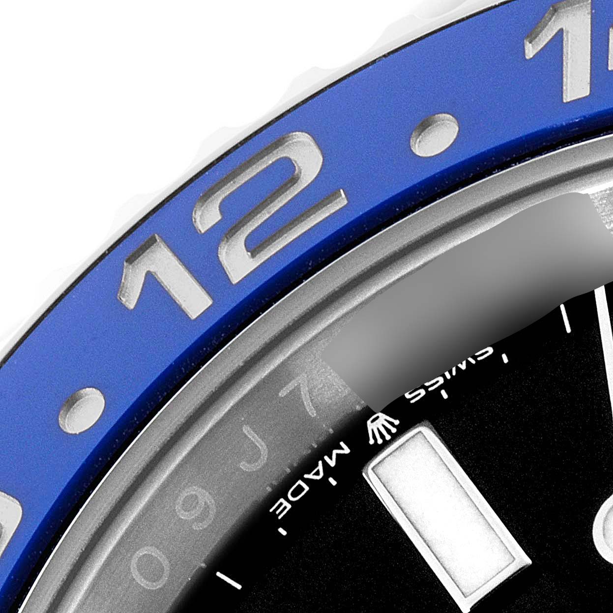 This close-up image shows the blue ceramic bezel and part of the dial of the Rolex GMT-Master 126710 Men
s Stainless Steel Black Dial 126710 Men
s Stainless Steel Black Dial watch.