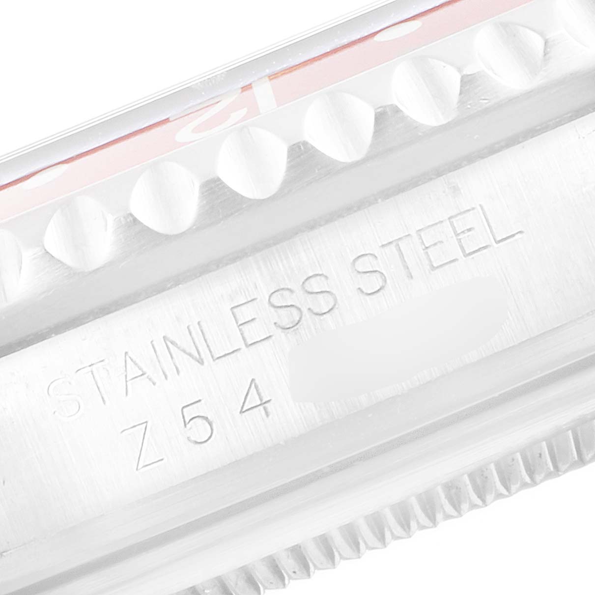 The image shows a close-up of the side case of a Rolex GMT-Master 16710 Men's Stainless Steel Black Dial 16710 Men's Stainless Steel Black Dial model, focusing on the "STAINLESS STEEL" engraving.