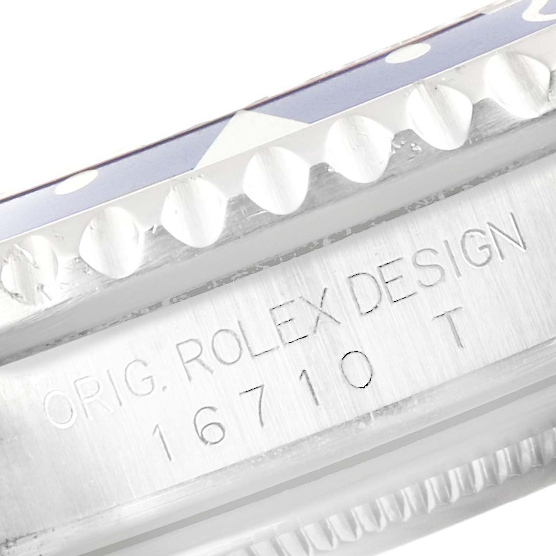 This close-up image shows the bezel and engraved case side of the Rolex GMT-Master 16710 Men's Stainless Steel Black Dial 16710 Men's Stainless Steel Black Dial model.