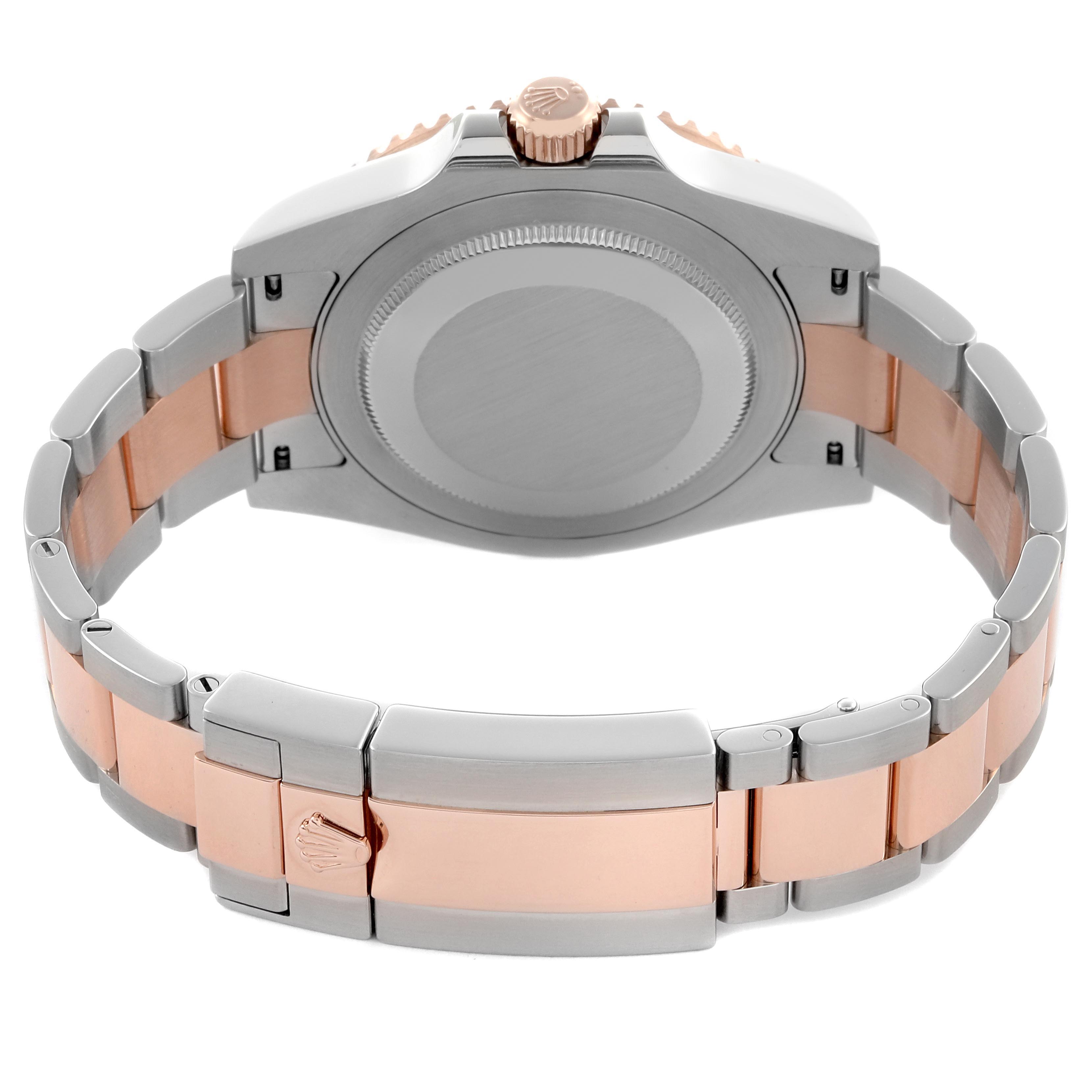 The image shows the back and clasp of the Rolex GMT-Master 126711CHNR Men's Steel and Gold (two tone) Black Dial 126711CHNR Men's Steel and Gold (two tone) Black Dial watch, focusing on its two-tone metal bracelet.